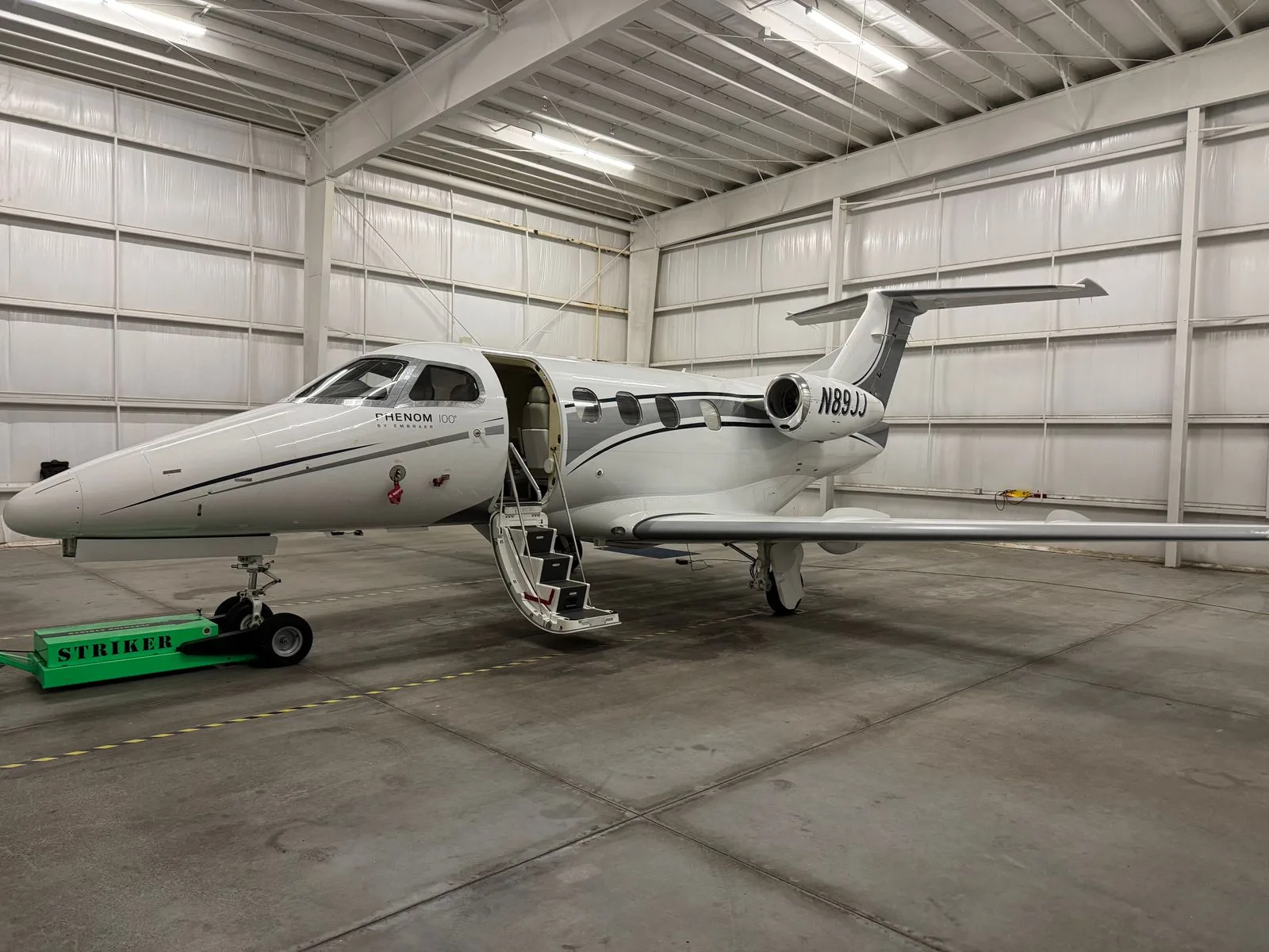 Exterior view of a 2010 Embraer Phenom 100.