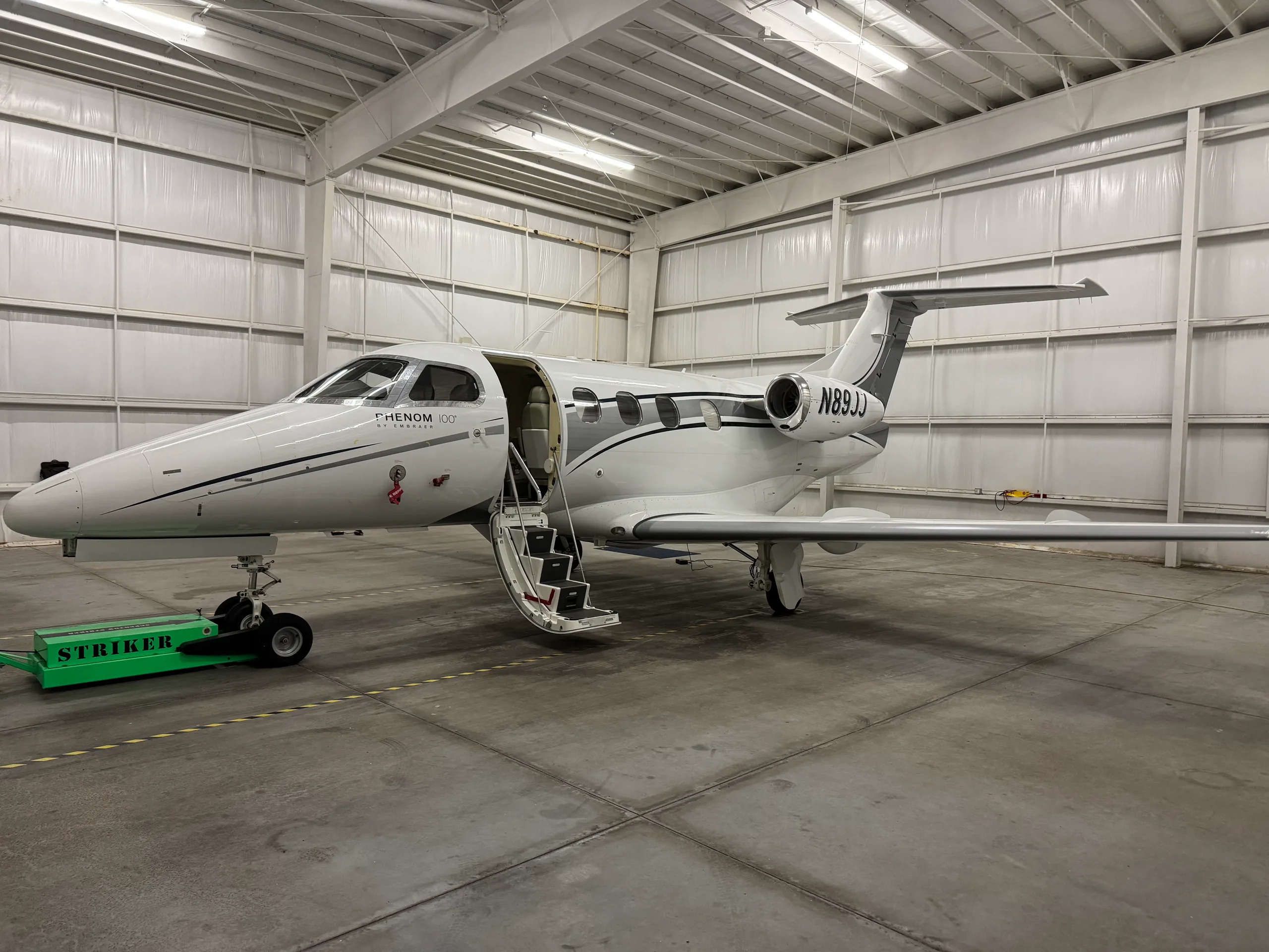 Exterior view of a 2010 Embraer Phenom 100.