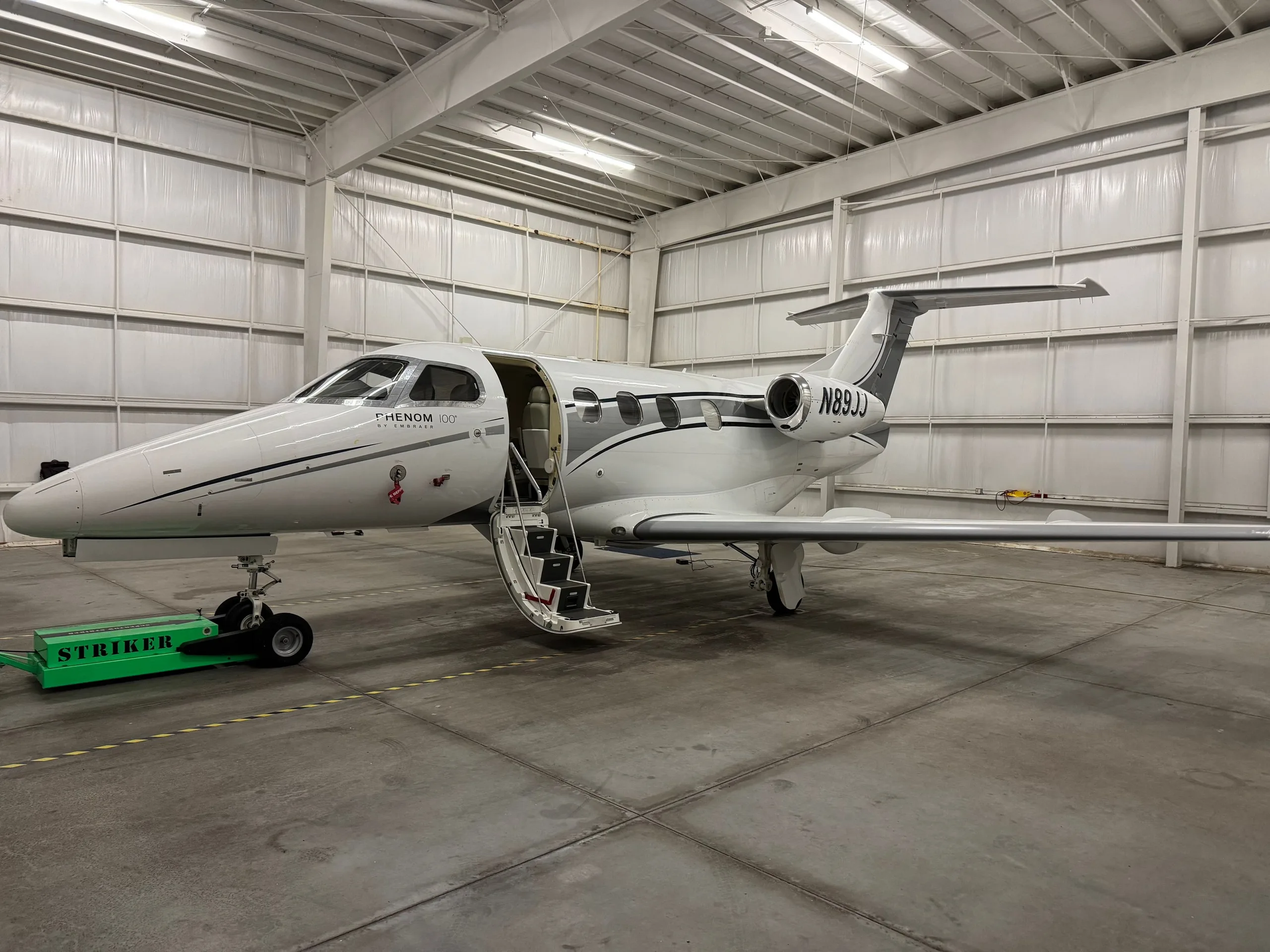 Exterior view of a 2010 Embraer Phenom 100.