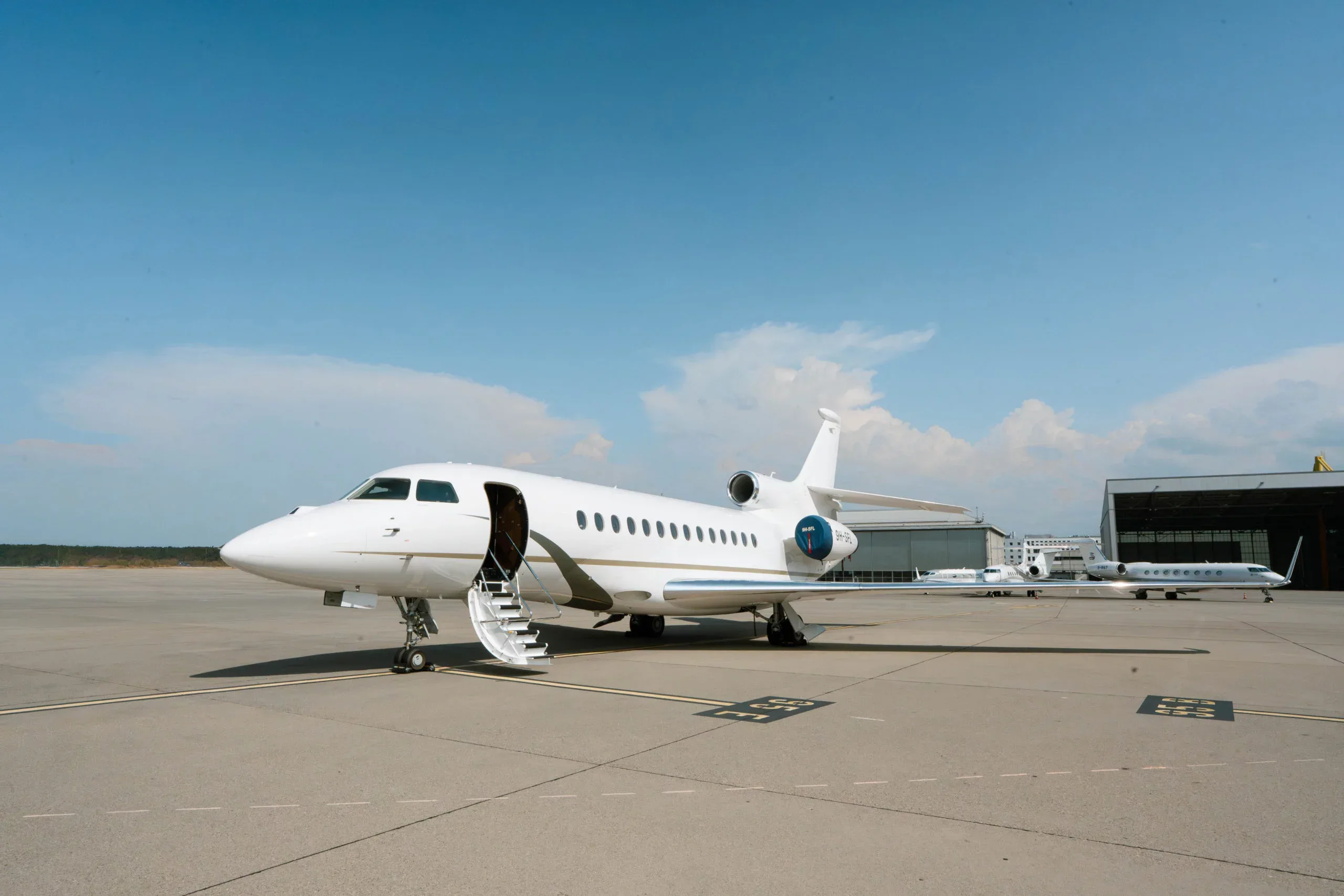 Exterior view of a 2015 Dassault Falcon 7X –, 9H-SFL.
