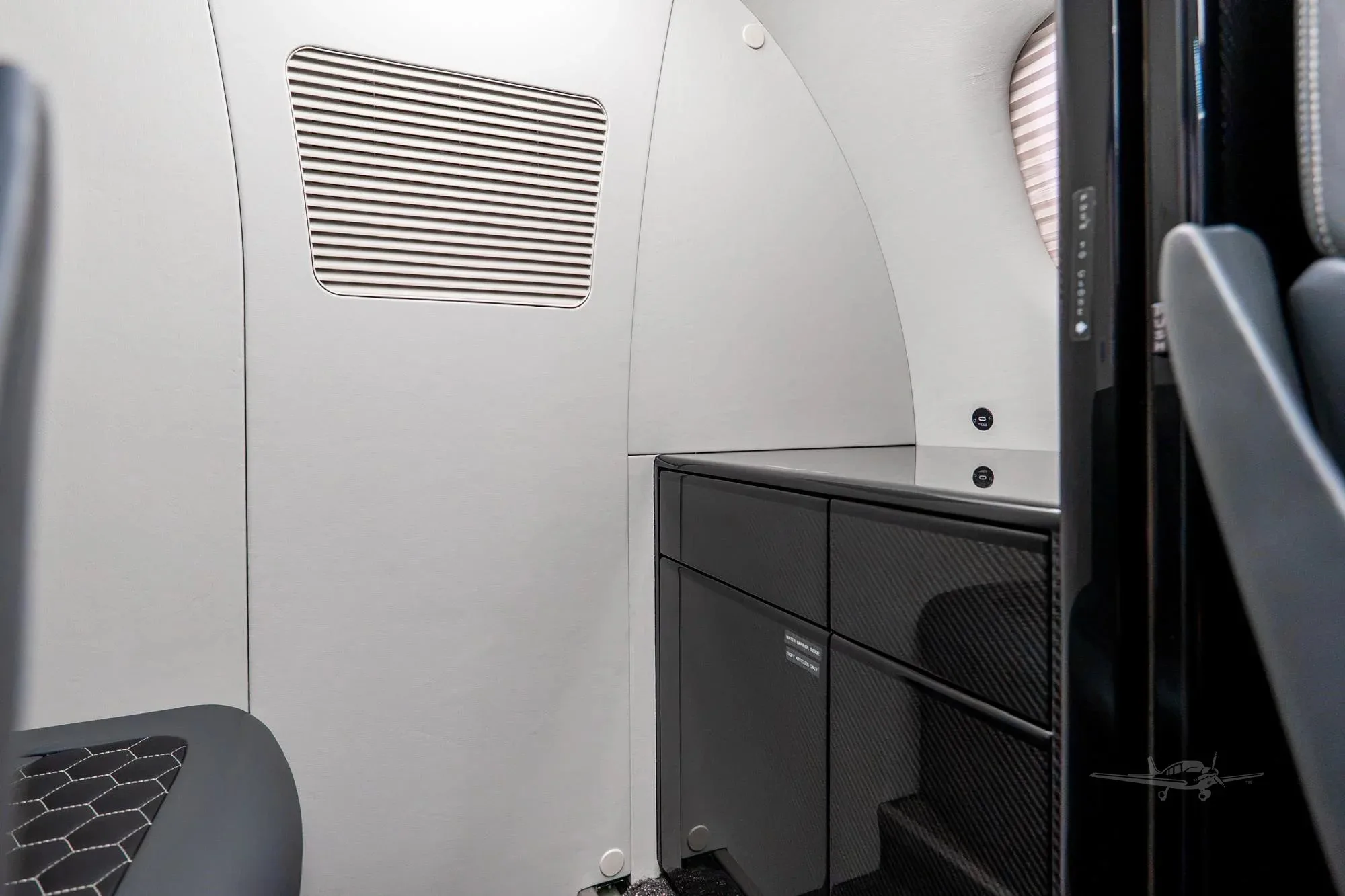 Cabin interior of a 2010 Embraer Phenom 100.