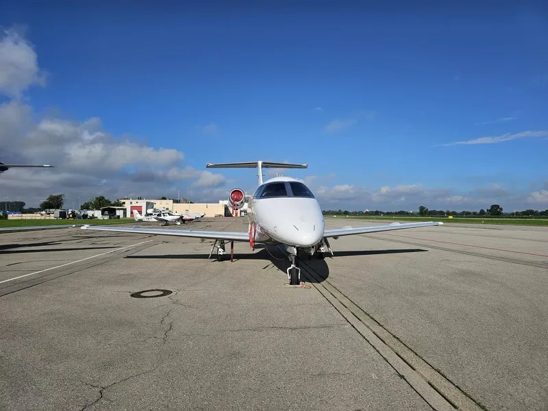 Exterior view of a 2011 Embraer Phenom 100.