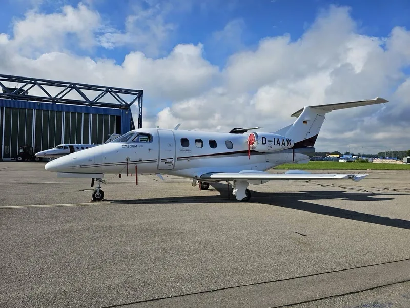 Exterior view of a 2011 Embraer Phenom 100.
