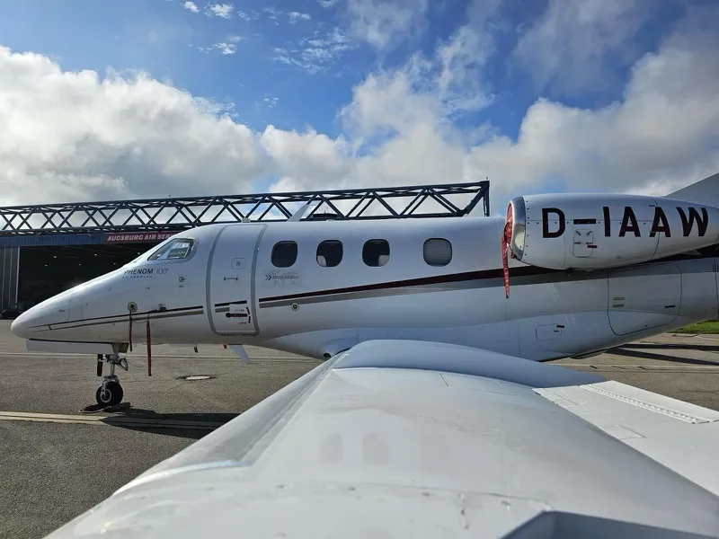 Exterior view of a 2011 Embraer Phenom 100.
