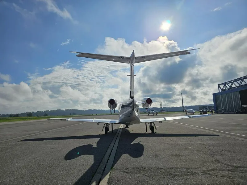 Exterior view of a 2011 Embraer Phenom 100.