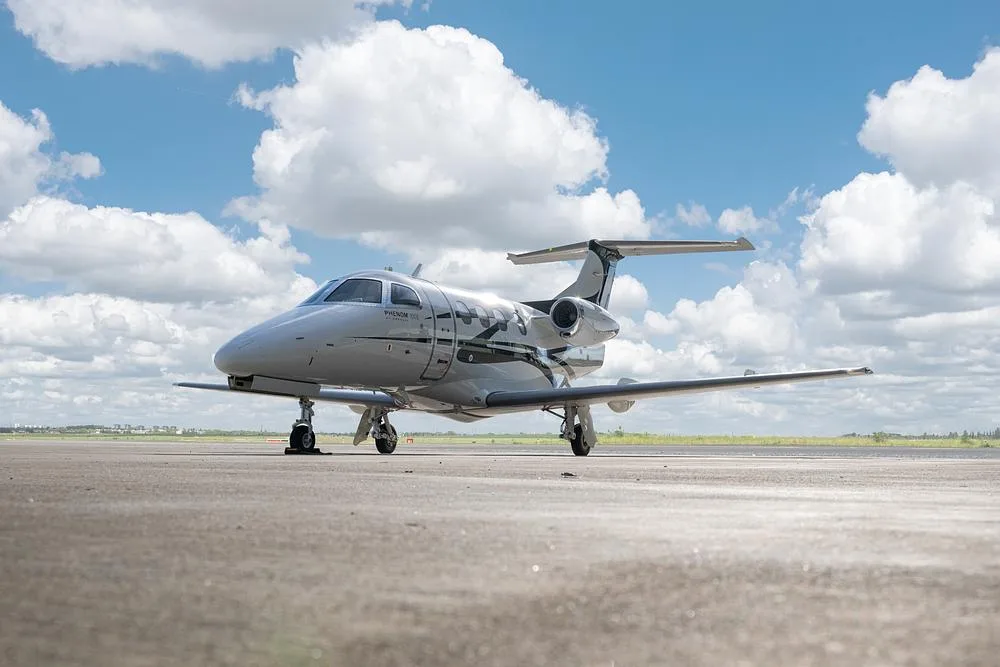 Exterior view of a 2015 Embraer Phenom 100, D-IWWM.