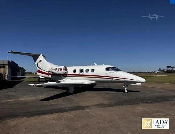 Exterior view of a 2013 Embraer Phenom 100, PR-FYB.