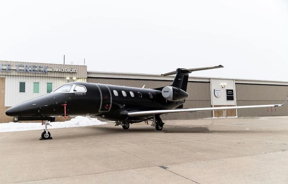 Exterior view of a 2012 Embraer Phenom 300, N506P.