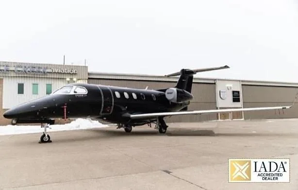 Exterior view of a 2012 Embraer Phenom 300, N506P.