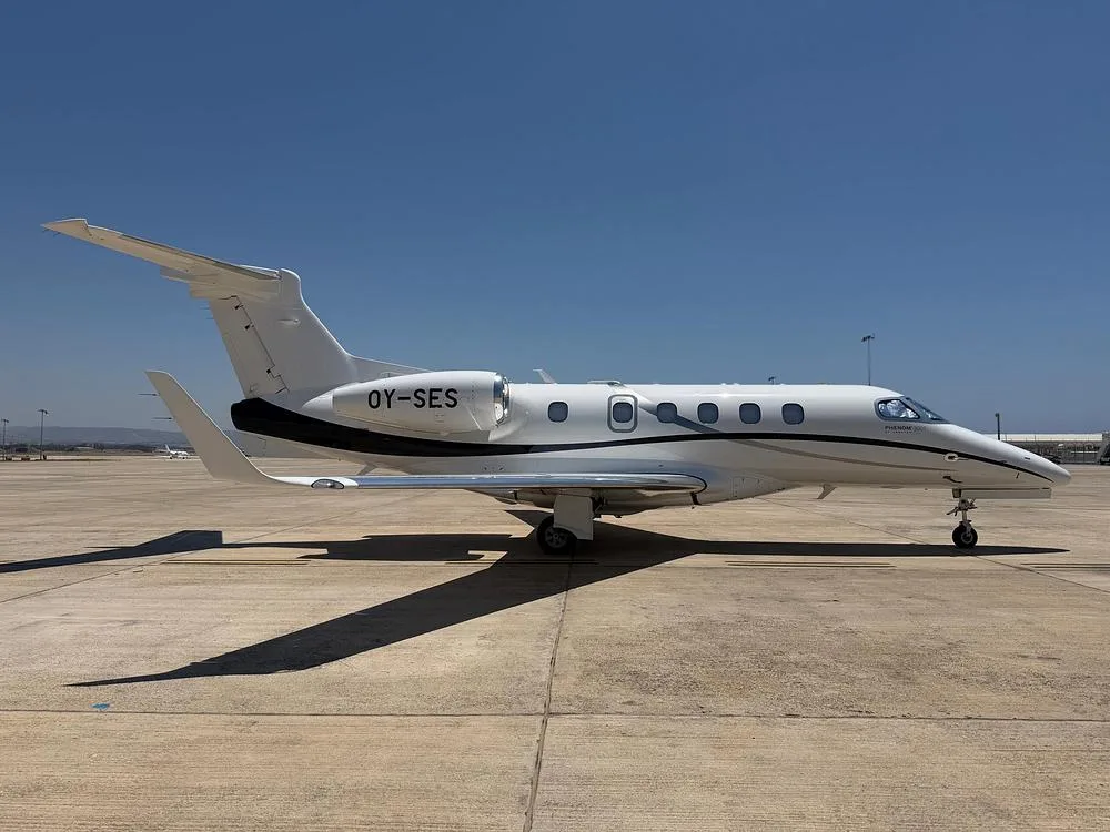 Exterior view of a 2024 Embraer Phenom 300E, OY-SES.