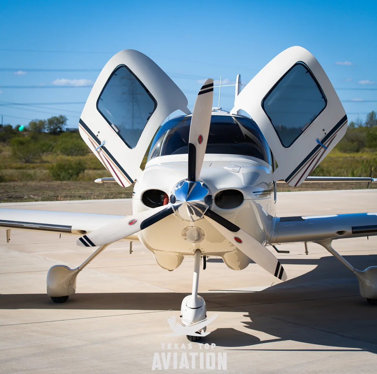 Exterior view of a 2003 Cirrus SR22, N8165H.
