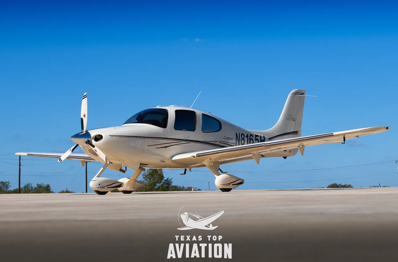 Exterior view of a 2003 Cirrus SR22, N8165H.