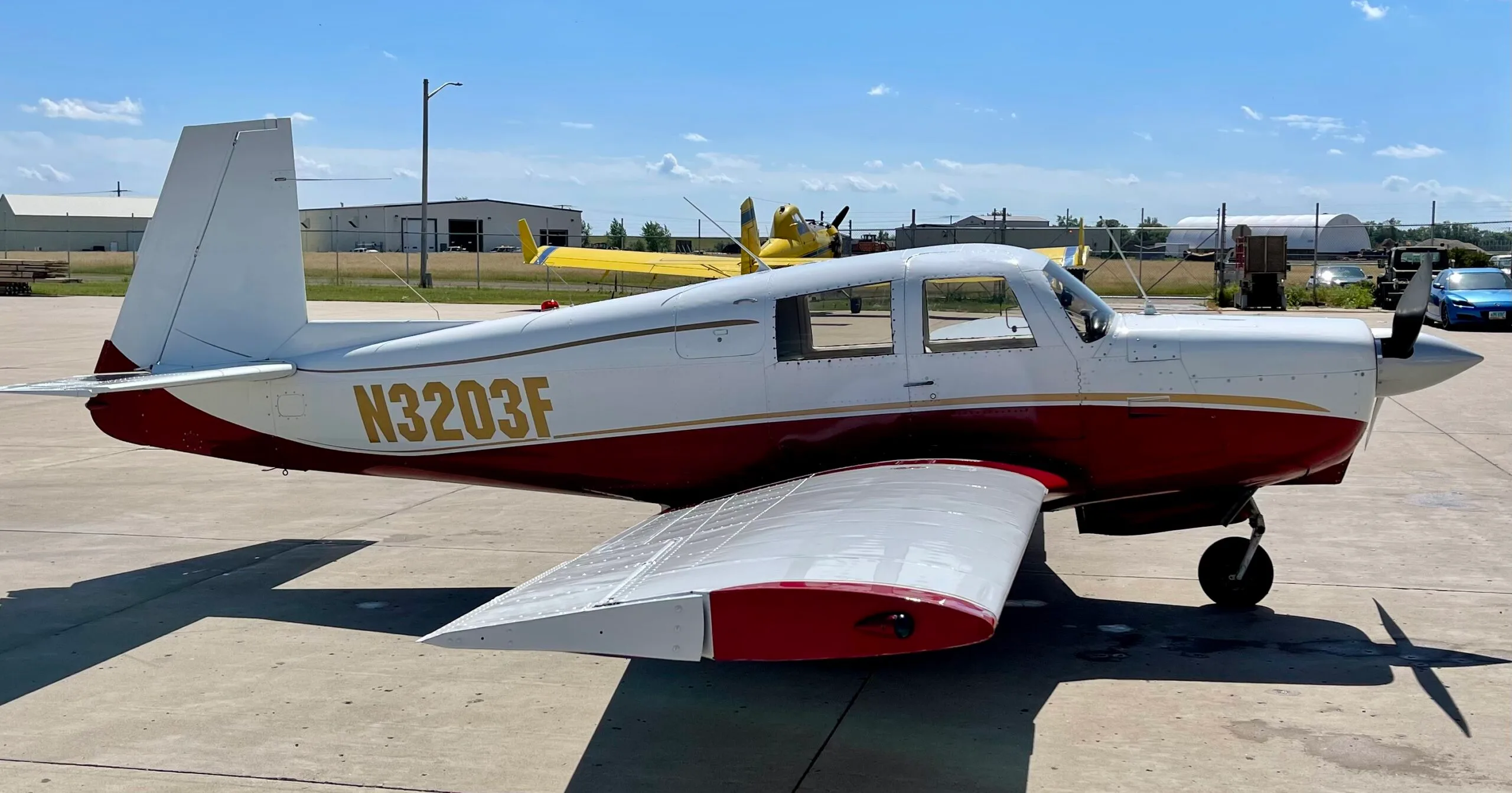 Exterior view of a 1967 Mooney M20C, N3203F.