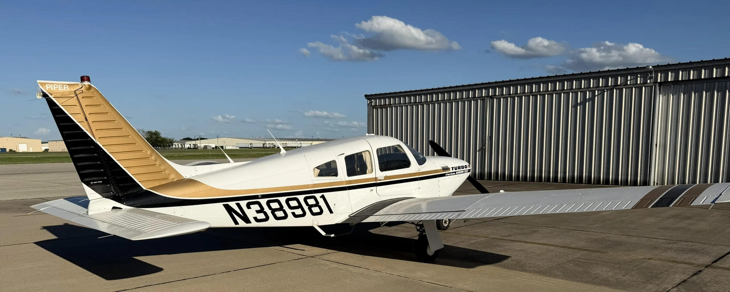 Exterior view of a 1977 Piper Turbo Arrow III, N38981.