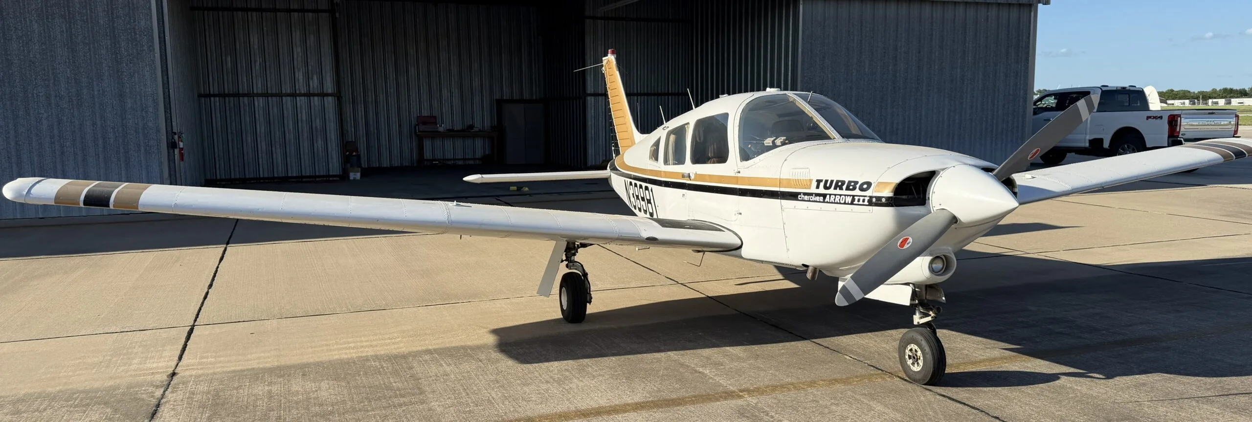 Exterior view of a 1977 Piper Turbo Arrow III, N38981.