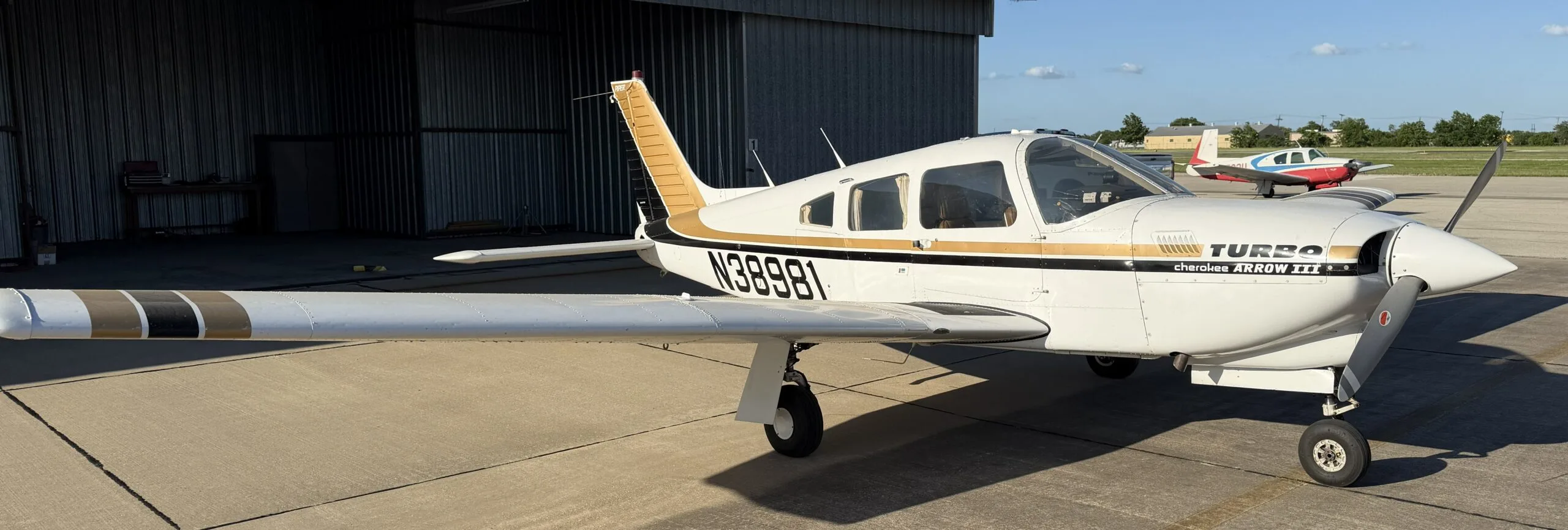 Exterior view of a 1977 Piper Turbo Arrow III, N38981.