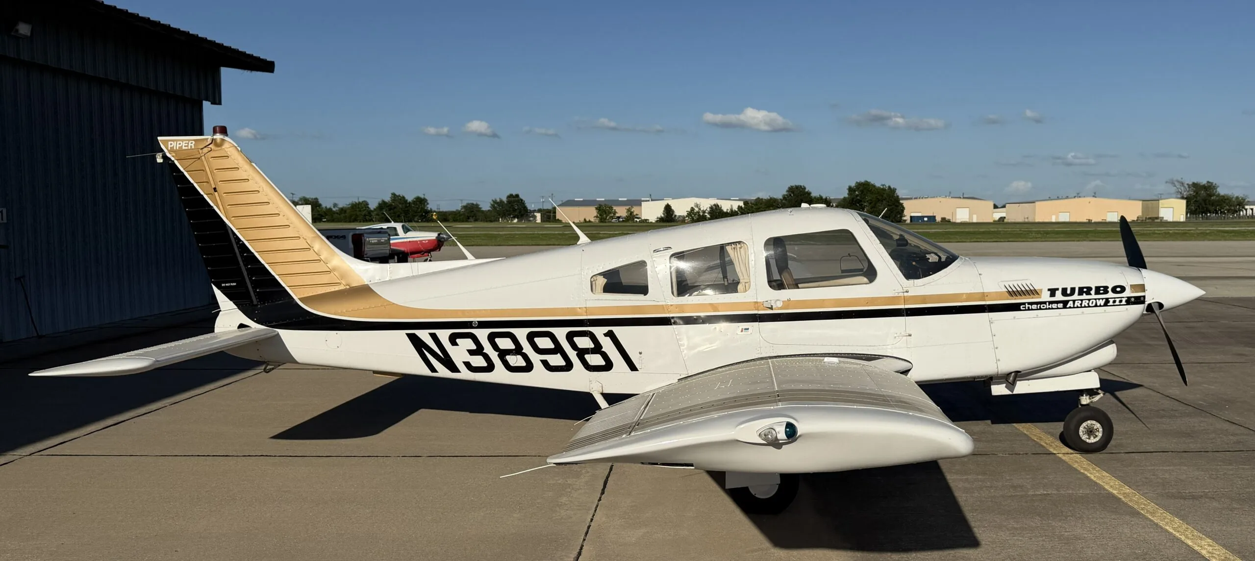 Exterior view of a 1977 Piper Turbo Arrow III, N38981.