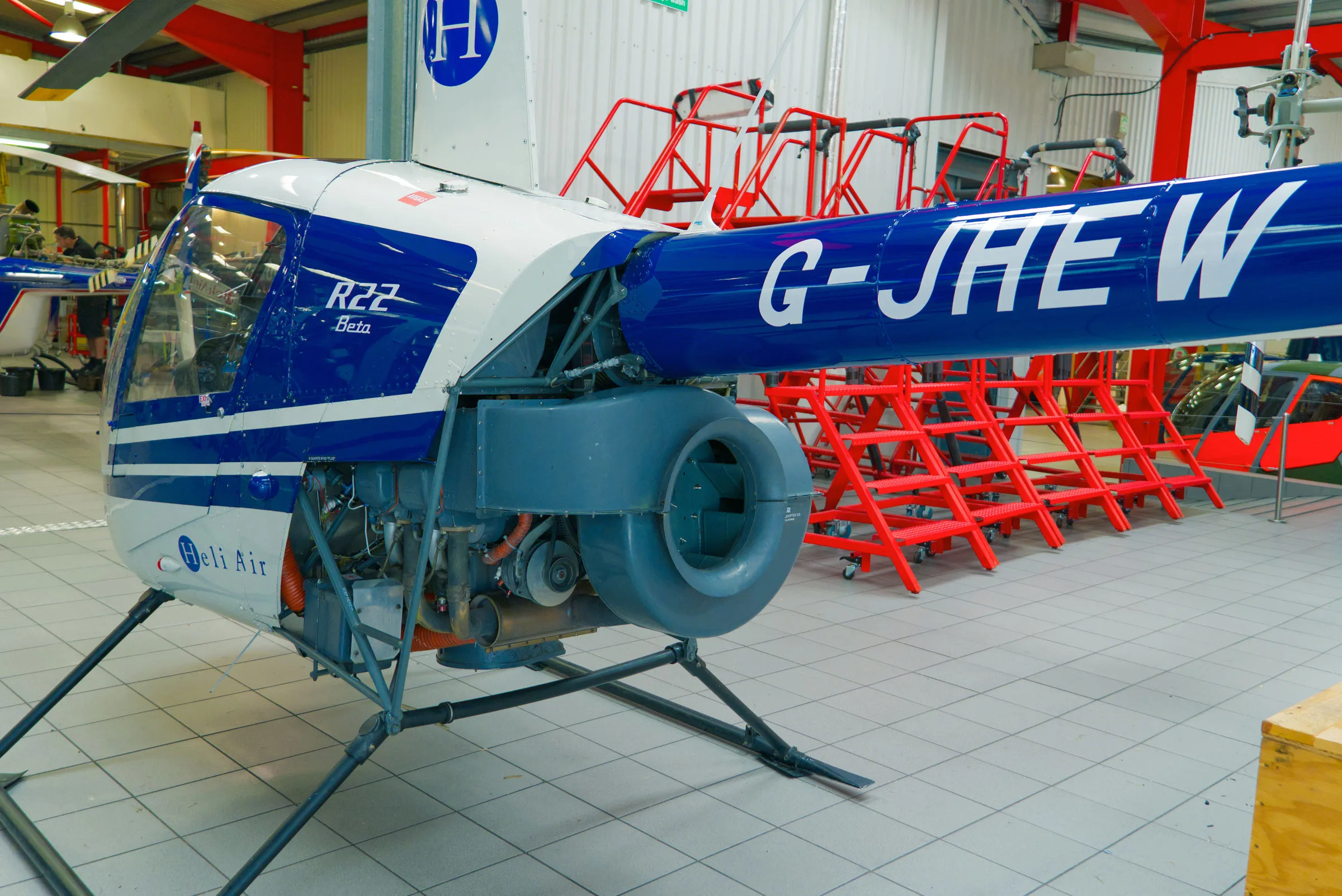 Exterior view of a 1987 Robinson R22 Beta, G-JHEW.