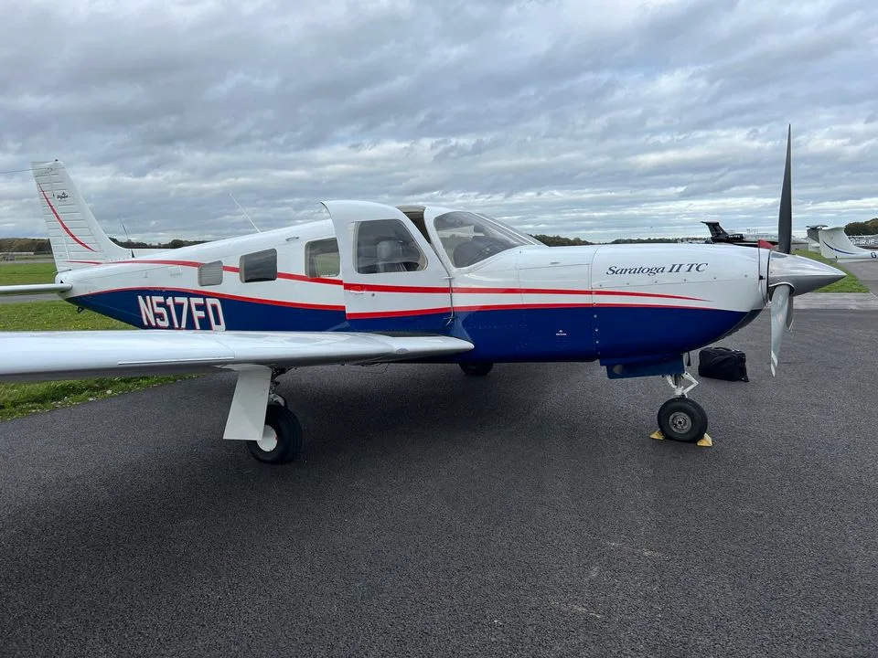 Exterior view of a 2001 Piper PA-32R-301T Saratoga 2 TC, N517FD.