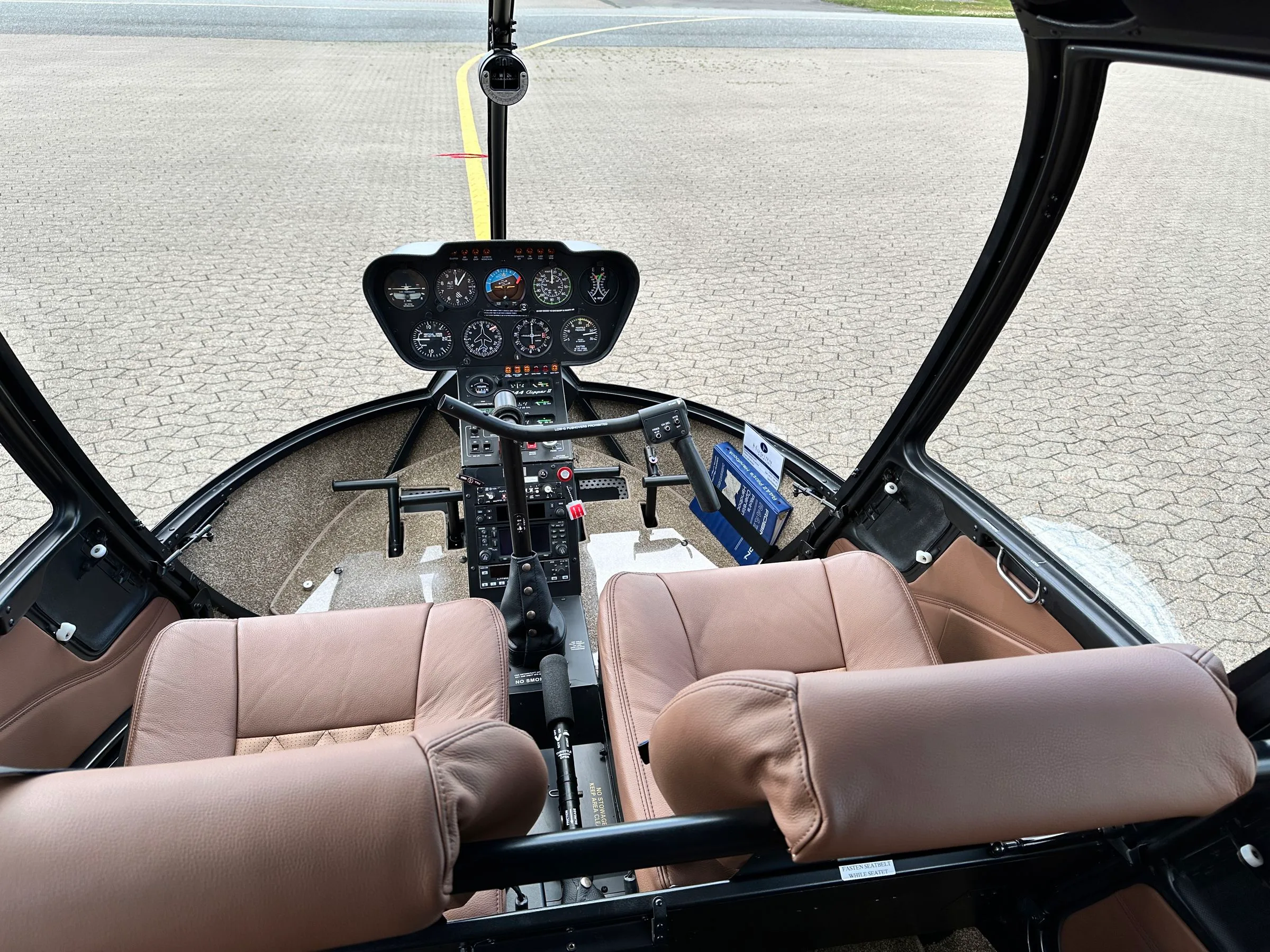 Cockpit and instrument panel of a 2007 Robinson R44 Clipper II.