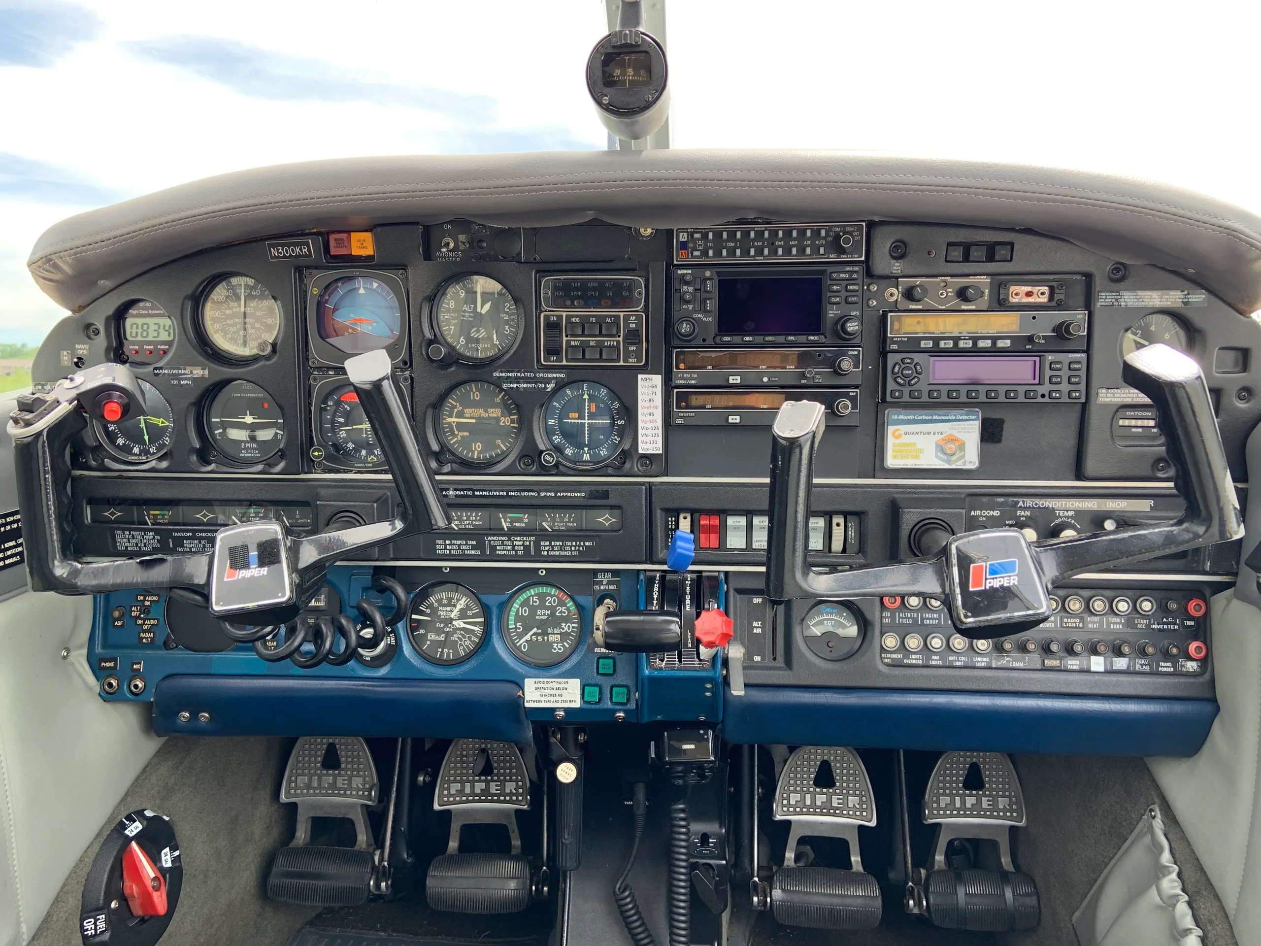 Cockpit and instrument panel of a Piper Arrow.