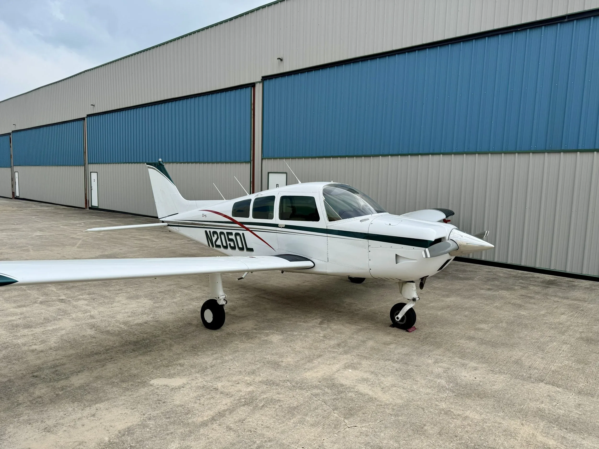 Exterior view of a 1976 Zane Co Aero C23 SUNDOWNER N2050L — Zane Co Aero, N2050L.