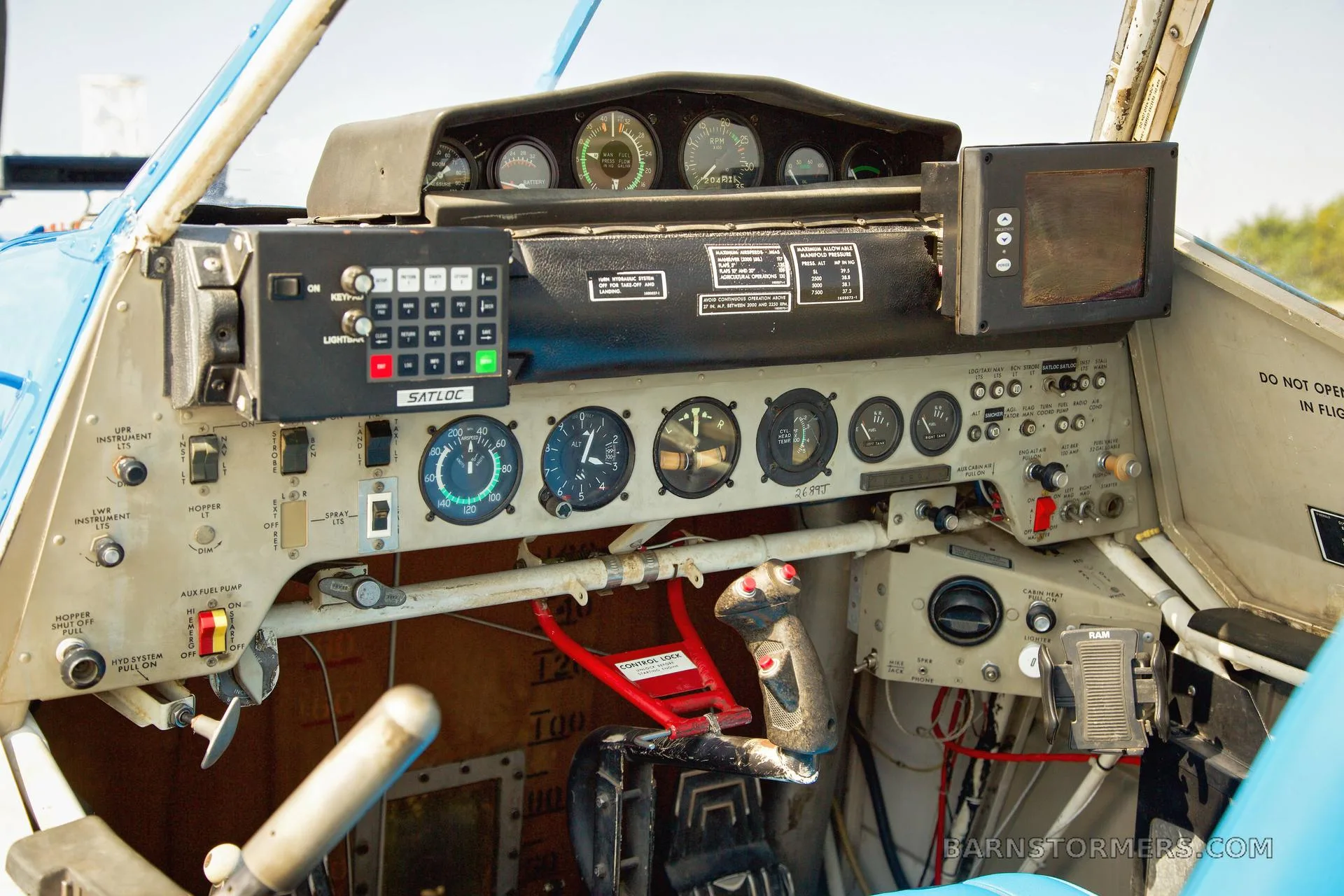 Cockpit and instrument panel of a 1979 Ag HUSKY FOR SALE.