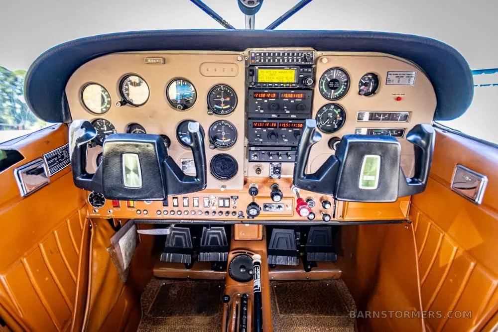 Cockpit and instrument panel of a 1974 Cessna A185F SKYWAGON.