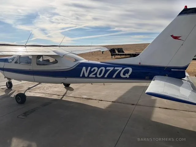 Exterior view of a 1973 Cessna 177RG, N2077Q.