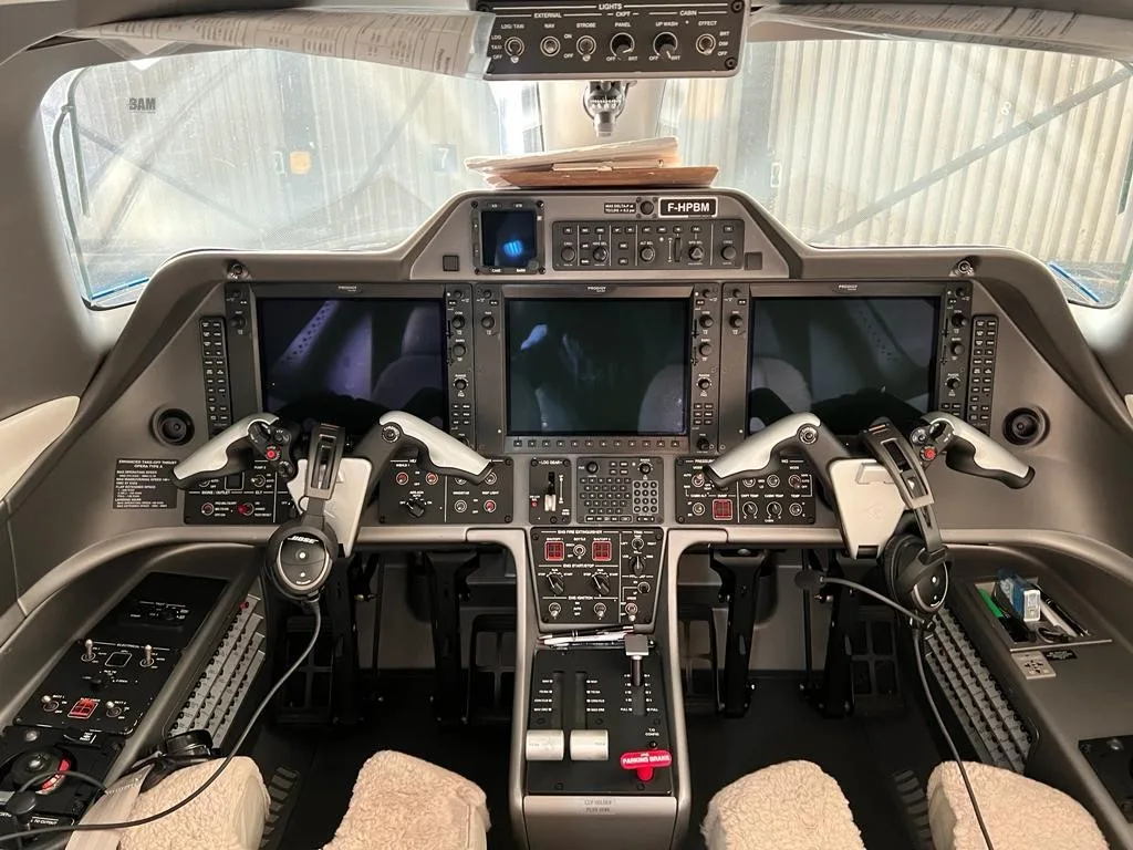 Cockpit and instrument panel of a 2013 EMBRAER PHENOM 100.
