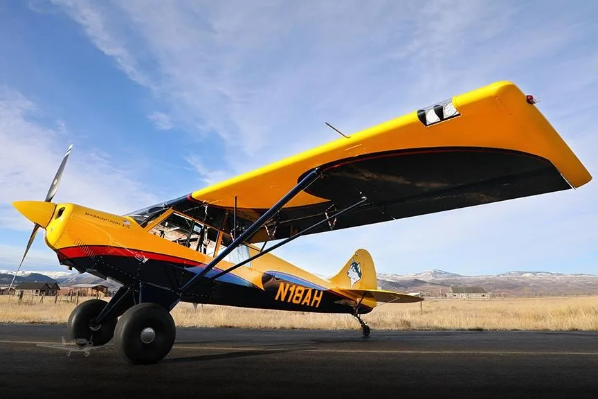 Exterior view of a 2019 AVIAT HUSKY A-1C-180, N18AH.