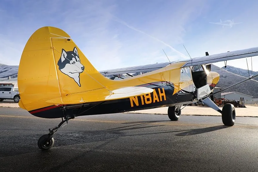 Exterior view of a 2019 AVIAT HUSKY A-1C-180, N18AH.