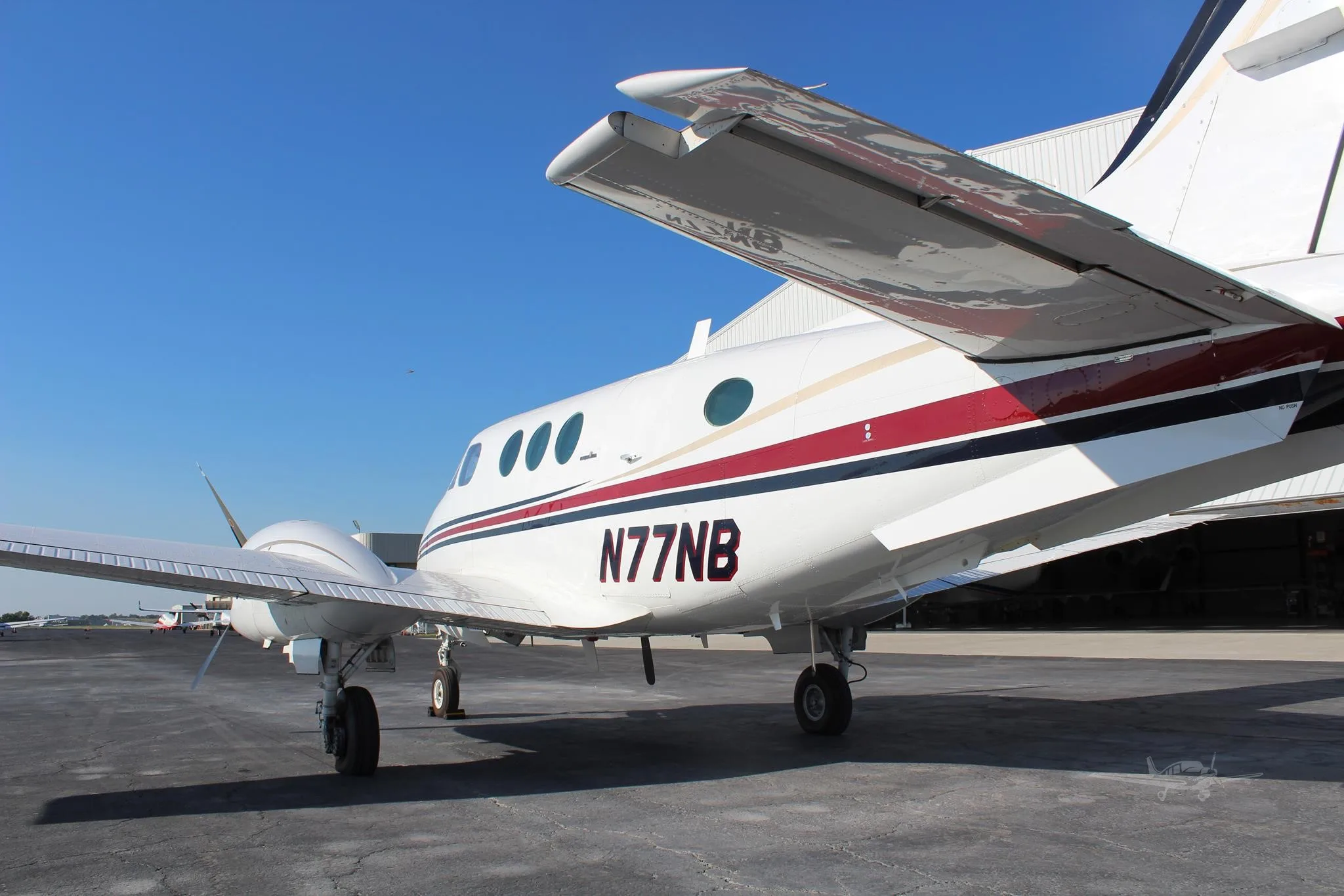 Exterior view of a 1979 BEECHCRAFT KING AIR C90, N77NB.