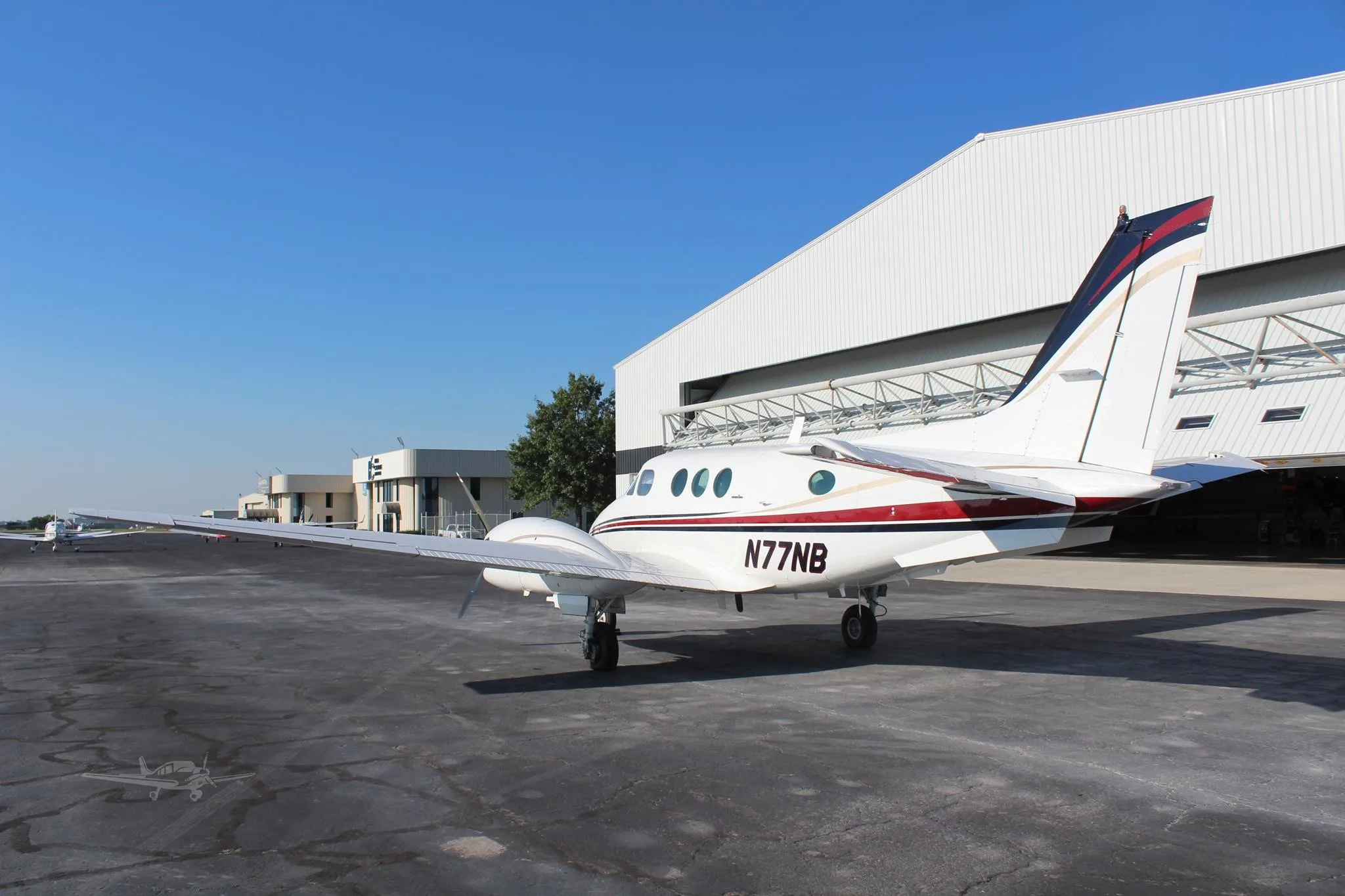 Exterior view of a 1979 BEECHCRAFT KING AIR C90, N77NB.