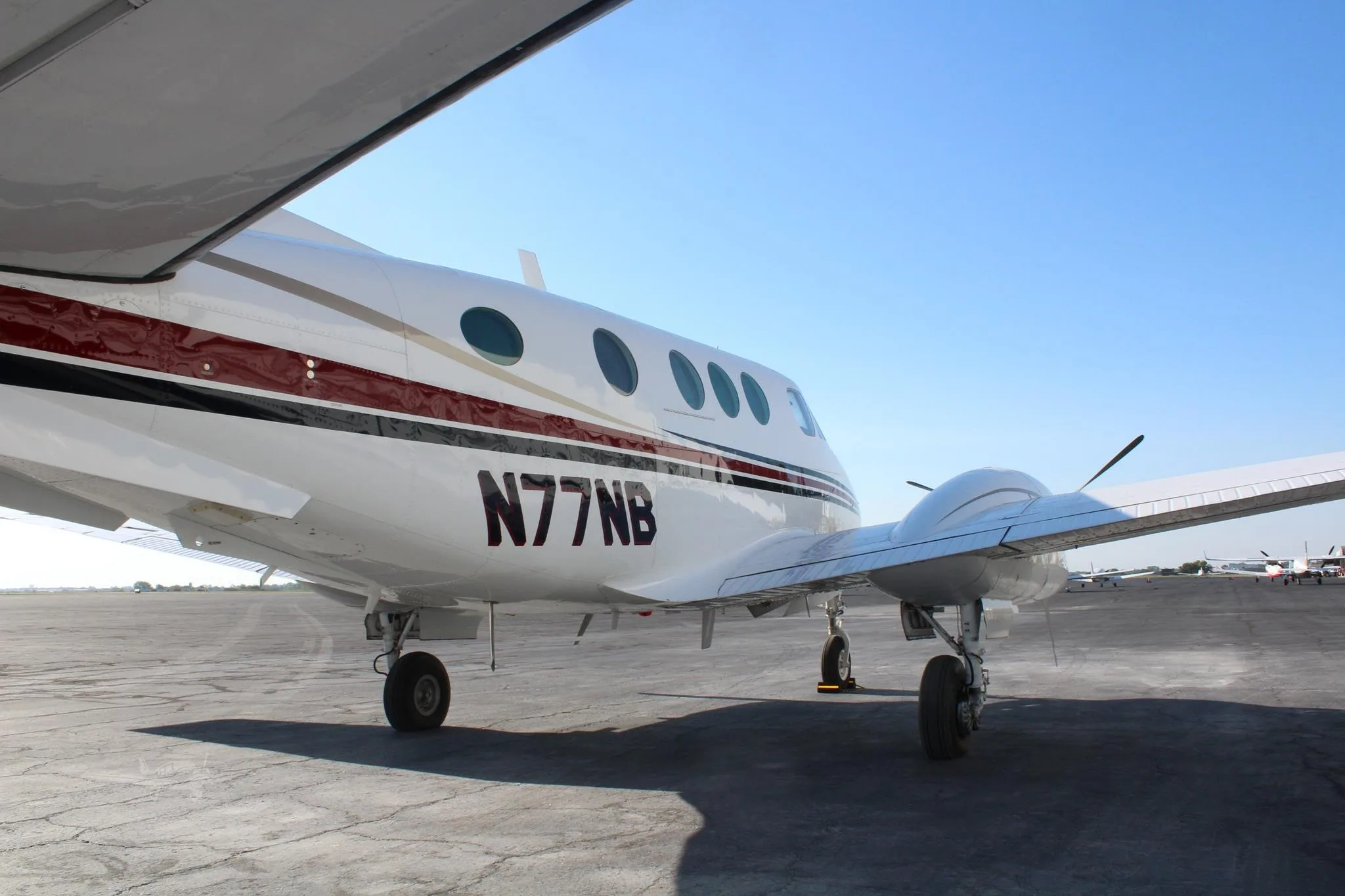 Exterior view of a 1979 BEECHCRAFT KING AIR C90, N77NB.