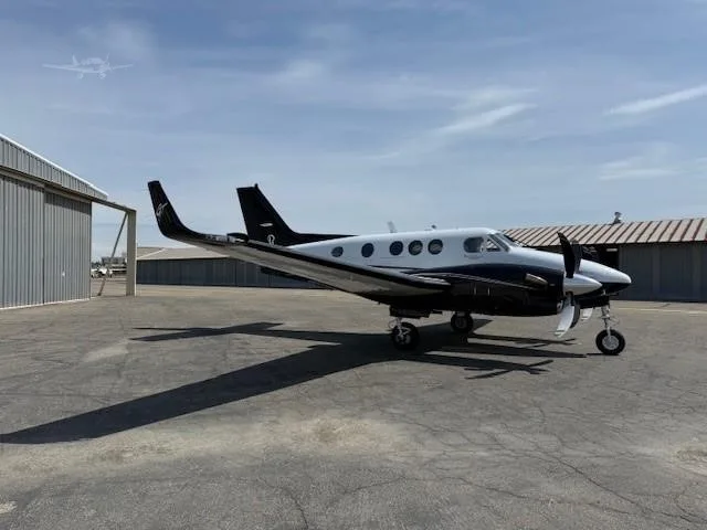 Exterior view of a 2011 BEECHCRAFT KING AIR C90GTI, N85FD.