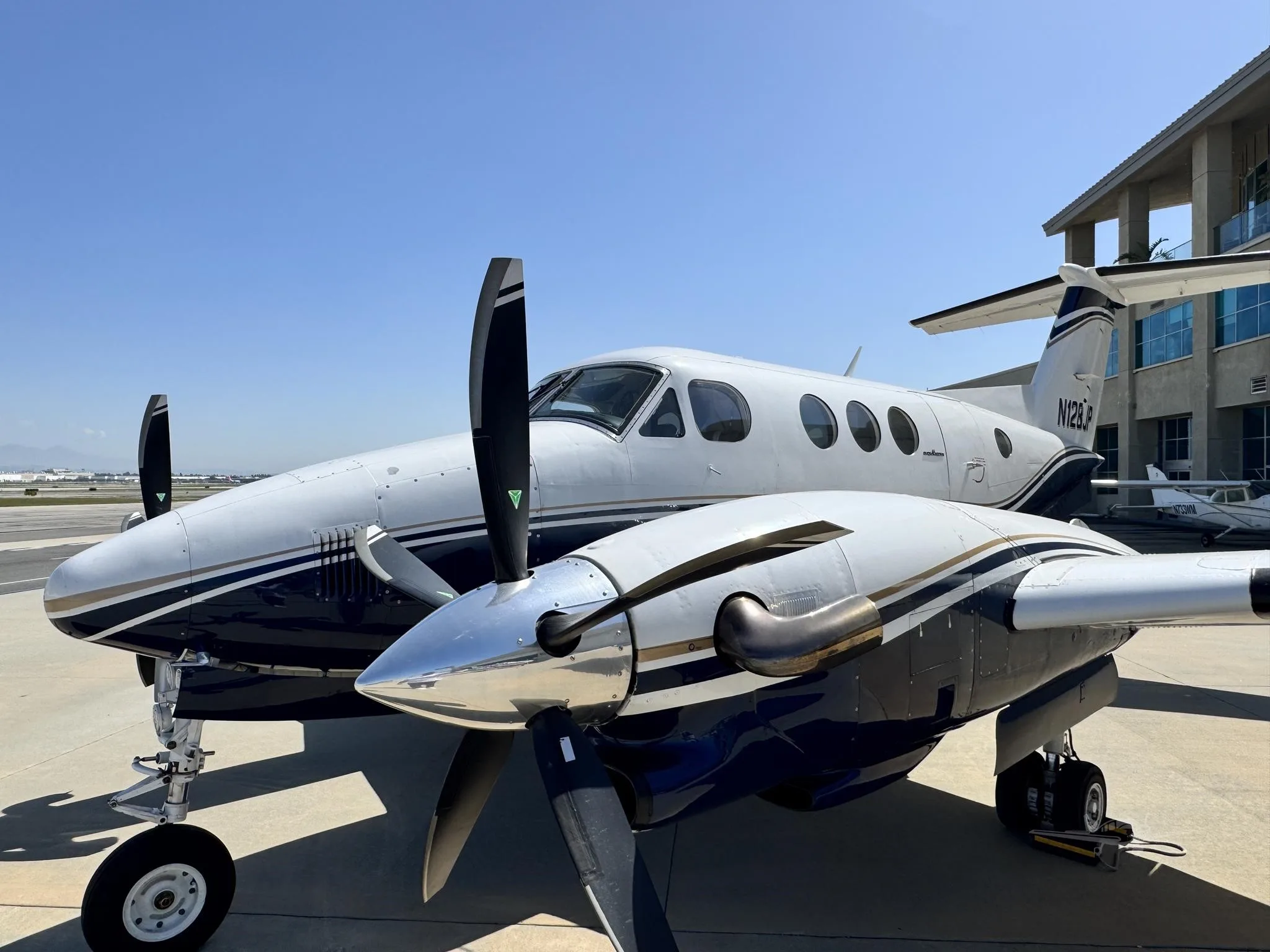 Exterior view of a 1980 BEECHCRAFT KING AIR F90, N128JP.