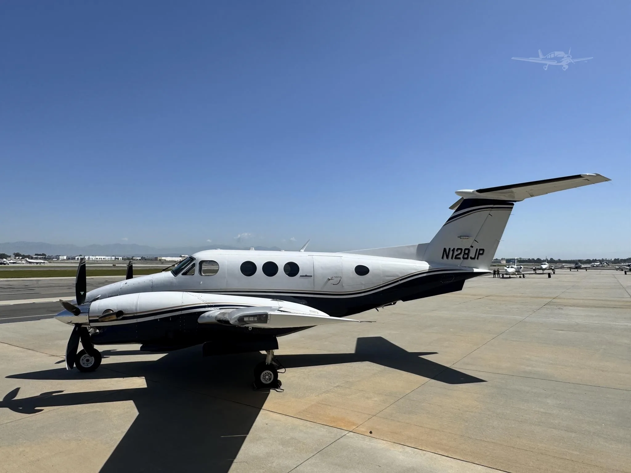Exterior view of a 1980 BEECHCRAFT KING AIR F90, N128JP.