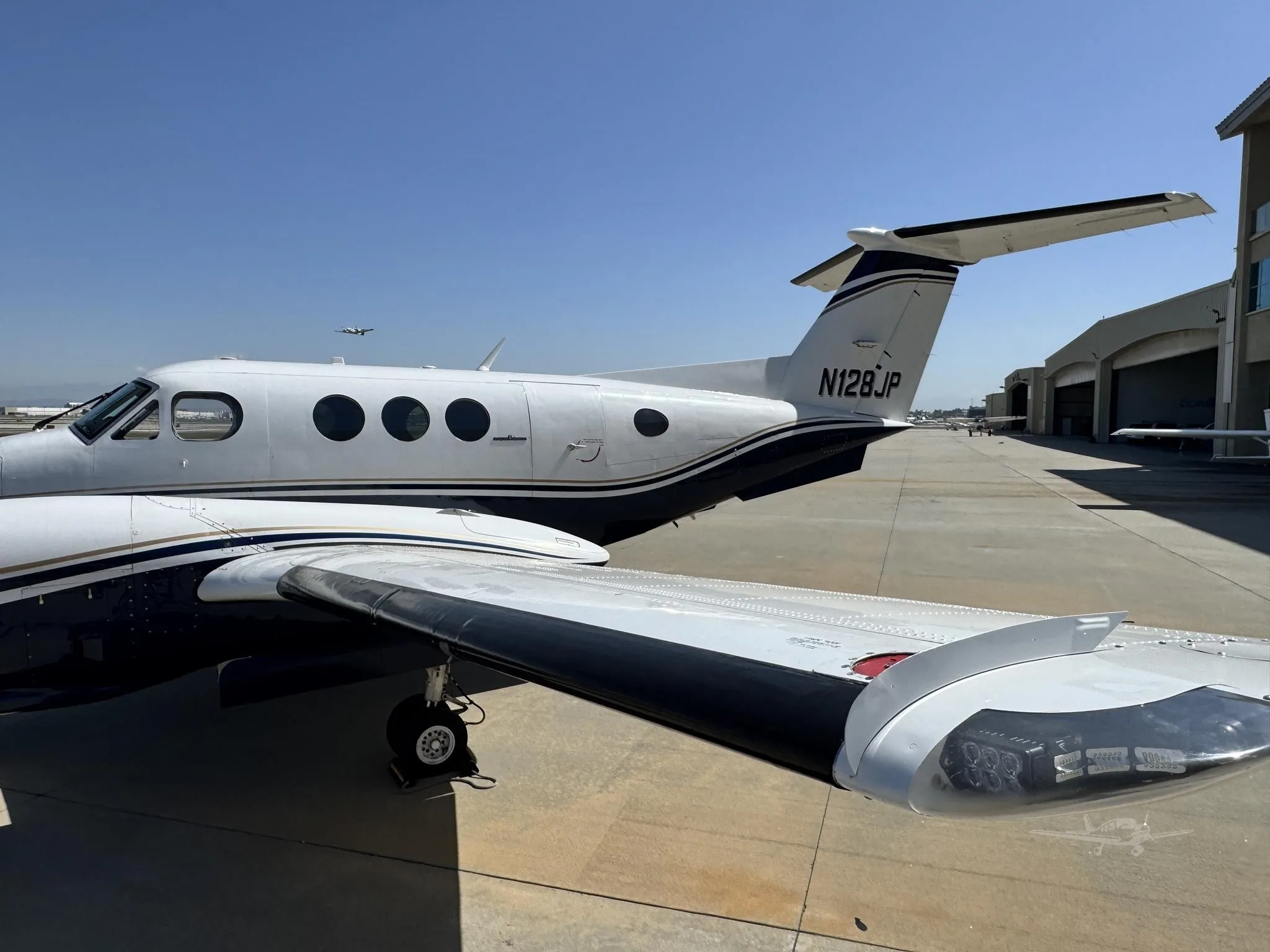 Exterior view of a 1980 BEECHCRAFT KING AIR F90, N128JP.