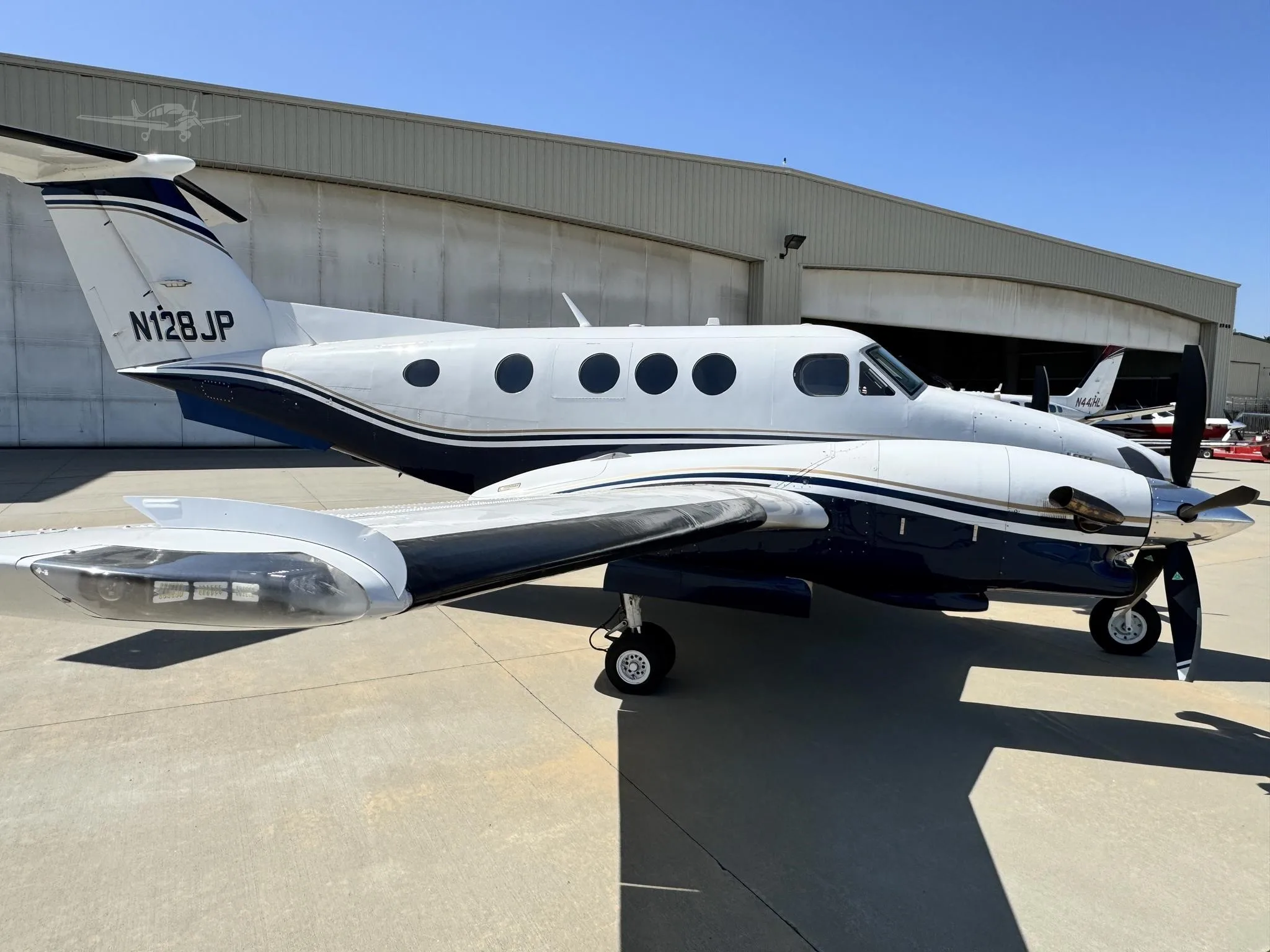 Exterior view of a 1980 BEECHCRAFT KING AIR F90, N128JP.
