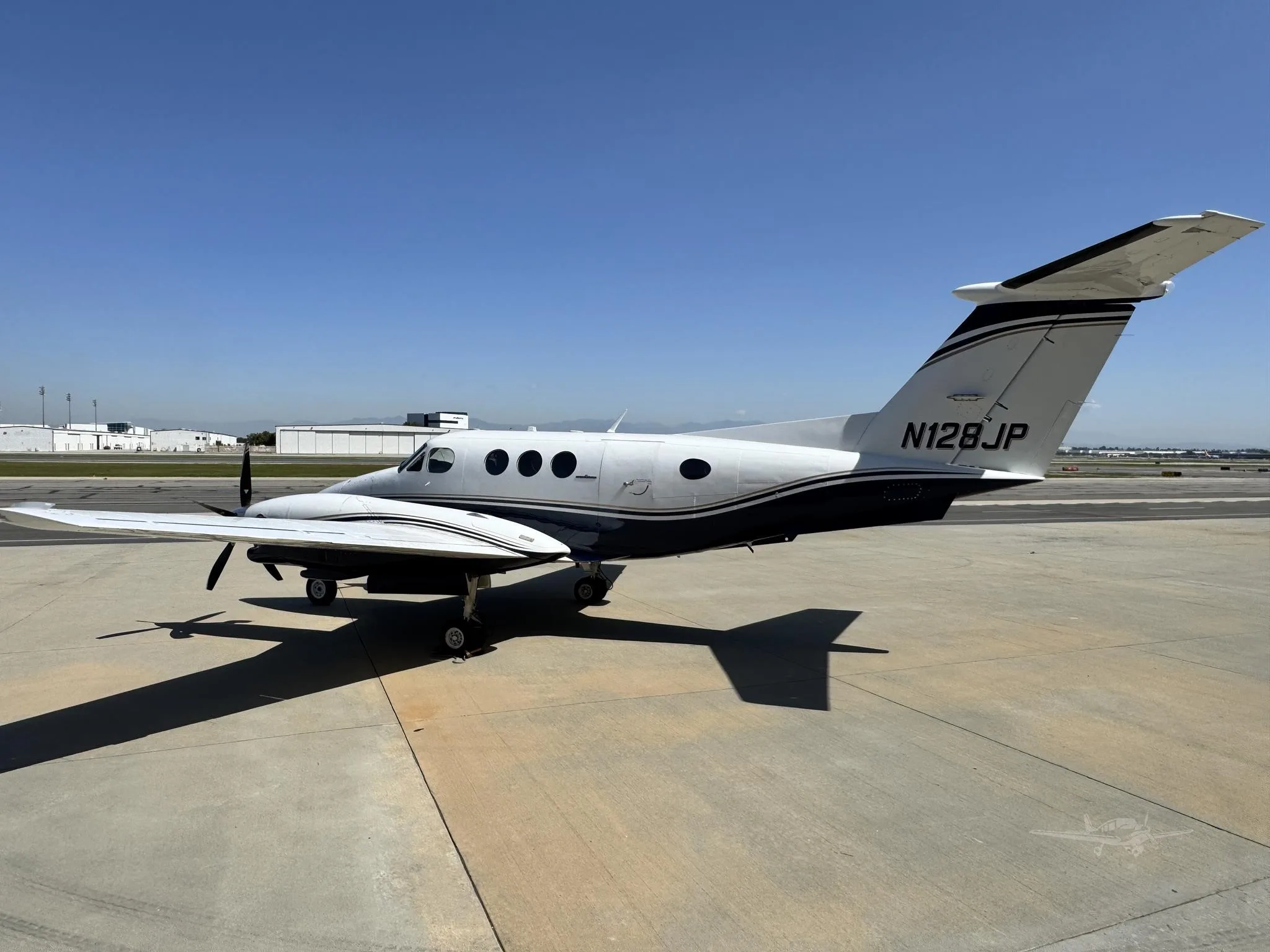Exterior view of a 1980 BEECHCRAFT KING AIR F90, N128JP.