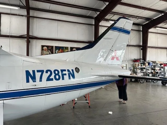 Exterior view of a 1974 MITSUBISHI MU 2K, N728FN.