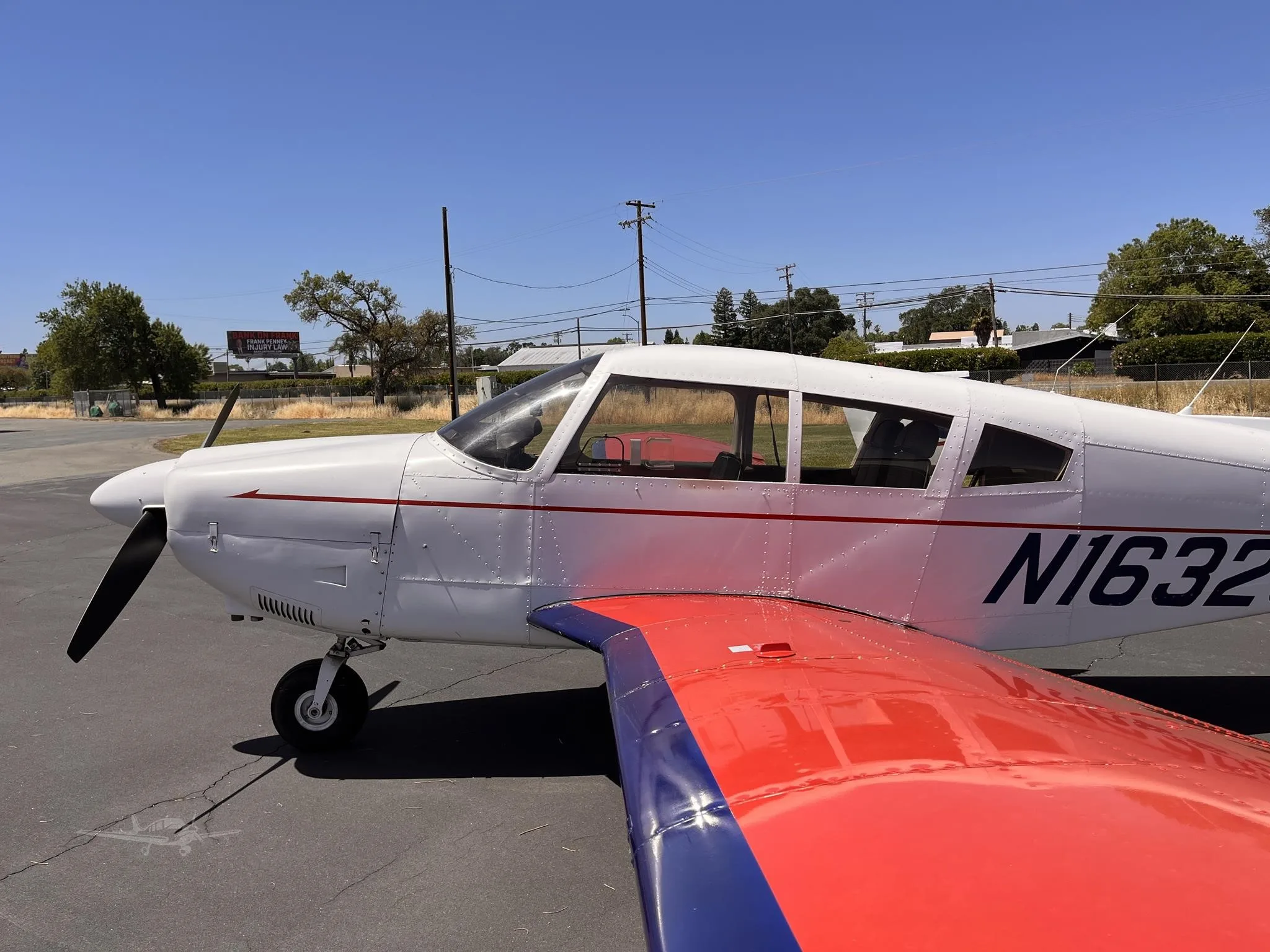 Exterior view of a 1973 PIPER CHEROKEE 180, N16320.