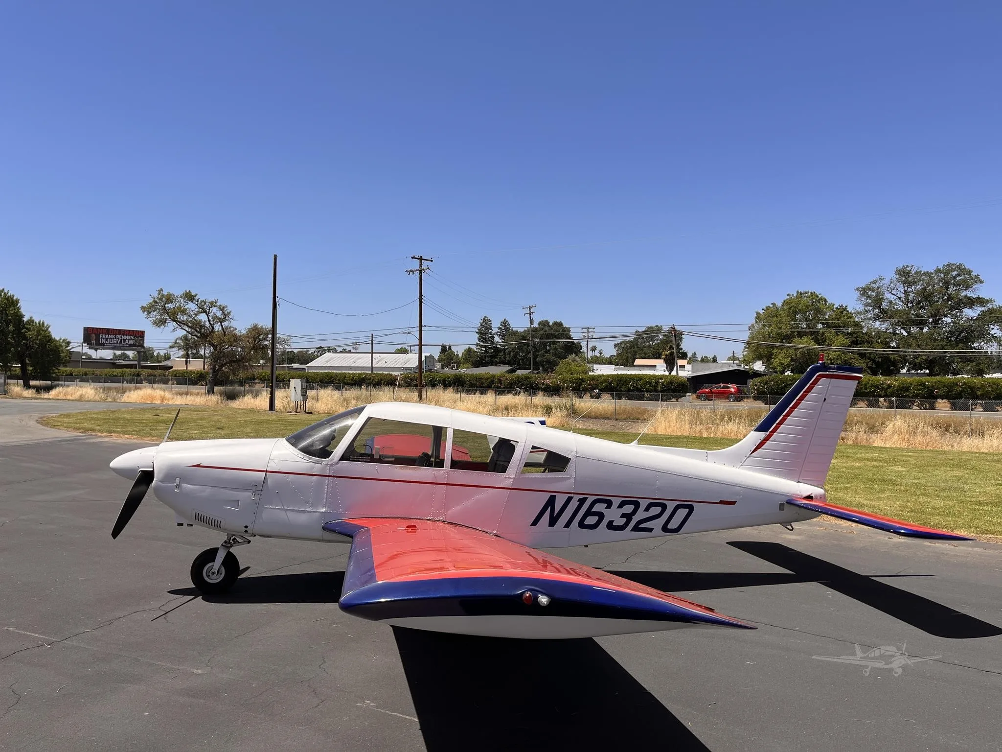 Exterior view of a 1973 PIPER CHEROKEE 180, N16320.