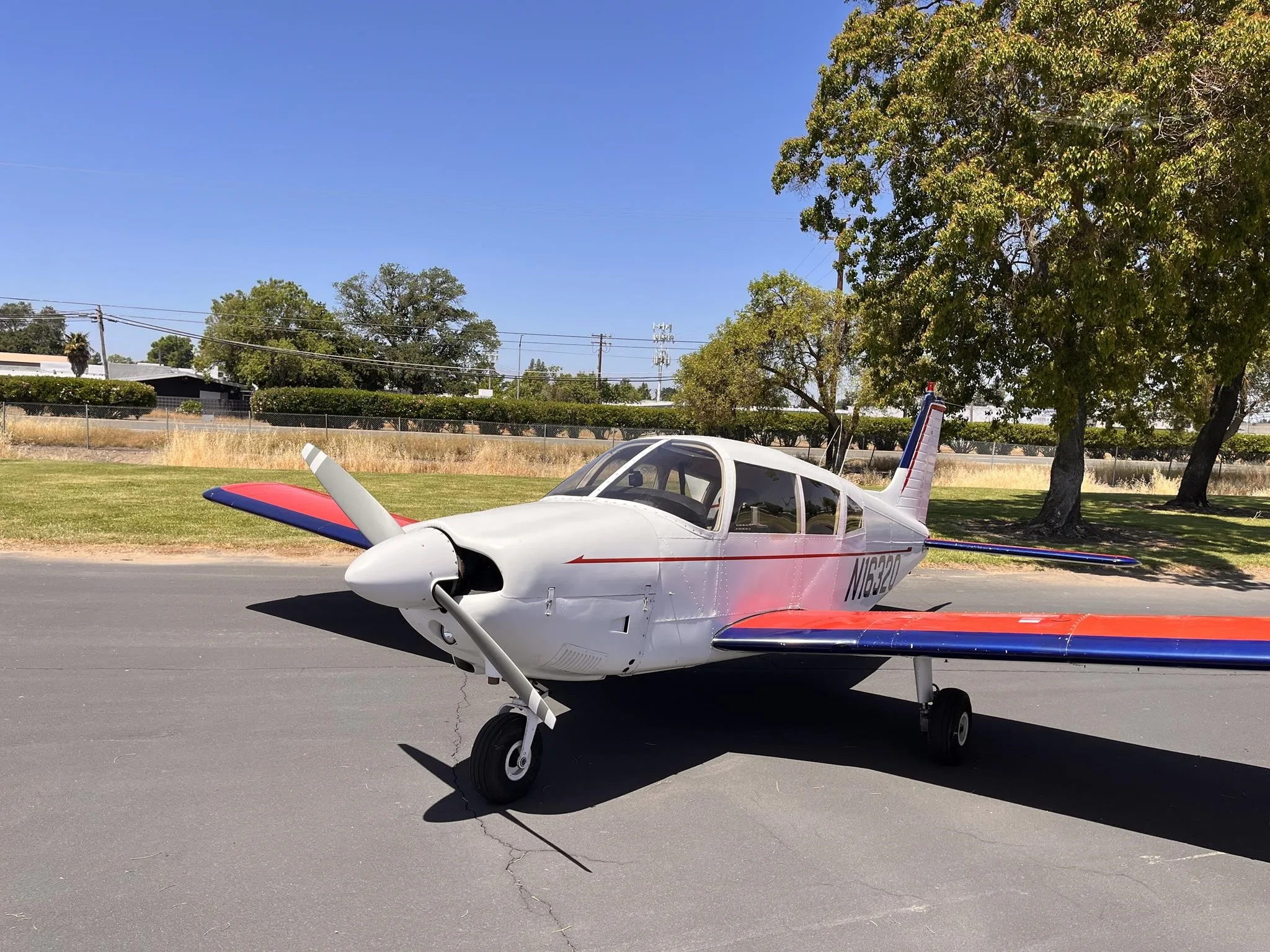 Exterior view of a 1973 PIPER CHEROKEE 180, N16320.