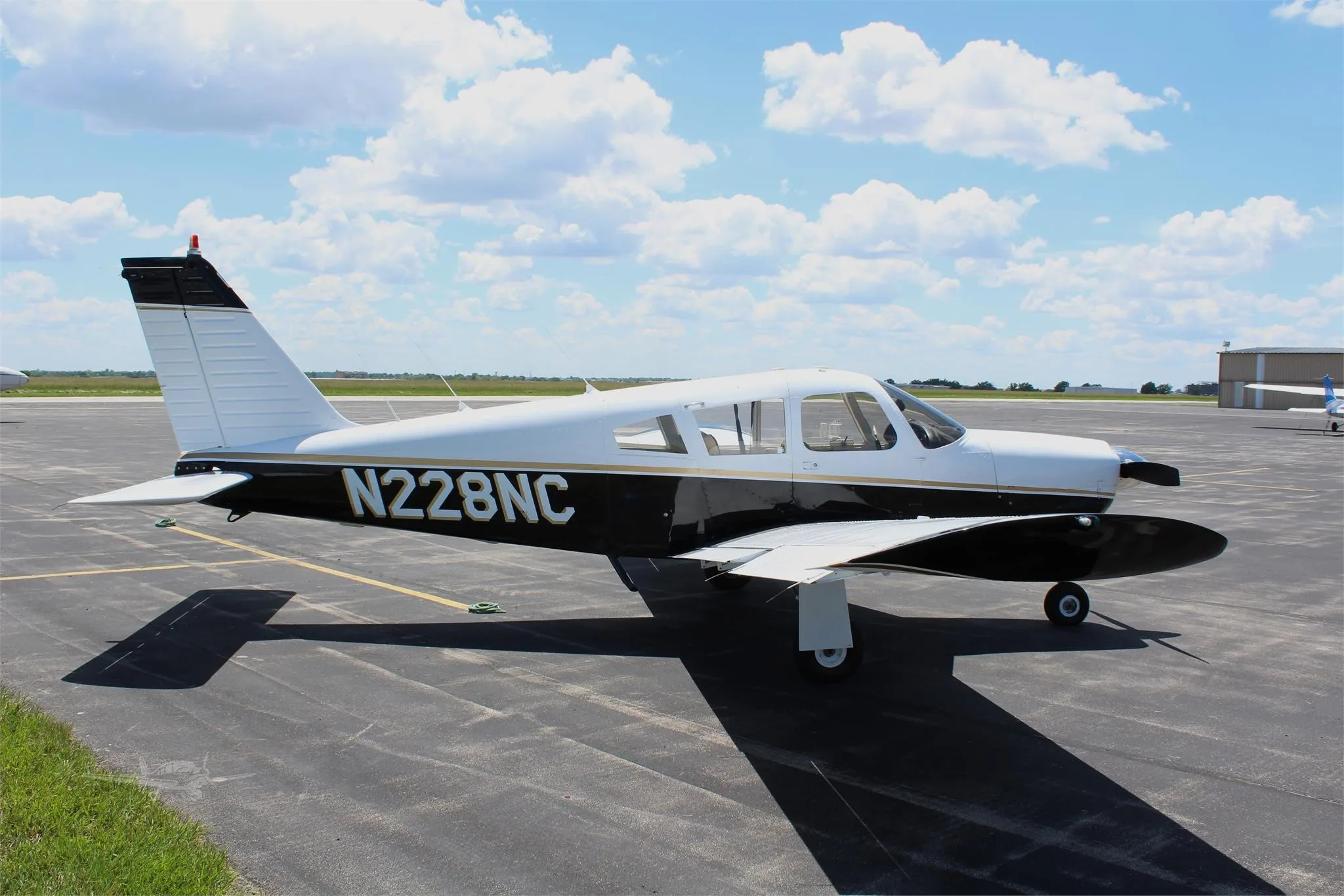 Exterior view of a 1969 PIPER ARROW, N228NC.