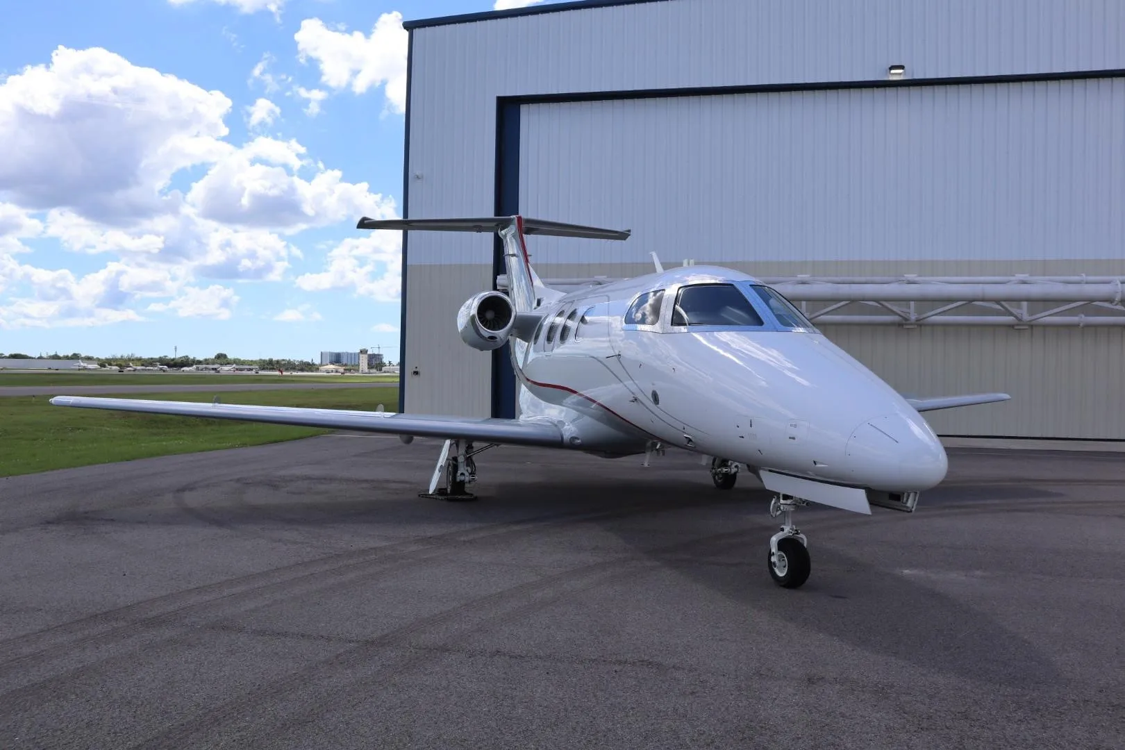 Exterior view of a 2009 EMBRAER PHENOM 100, N701TW.