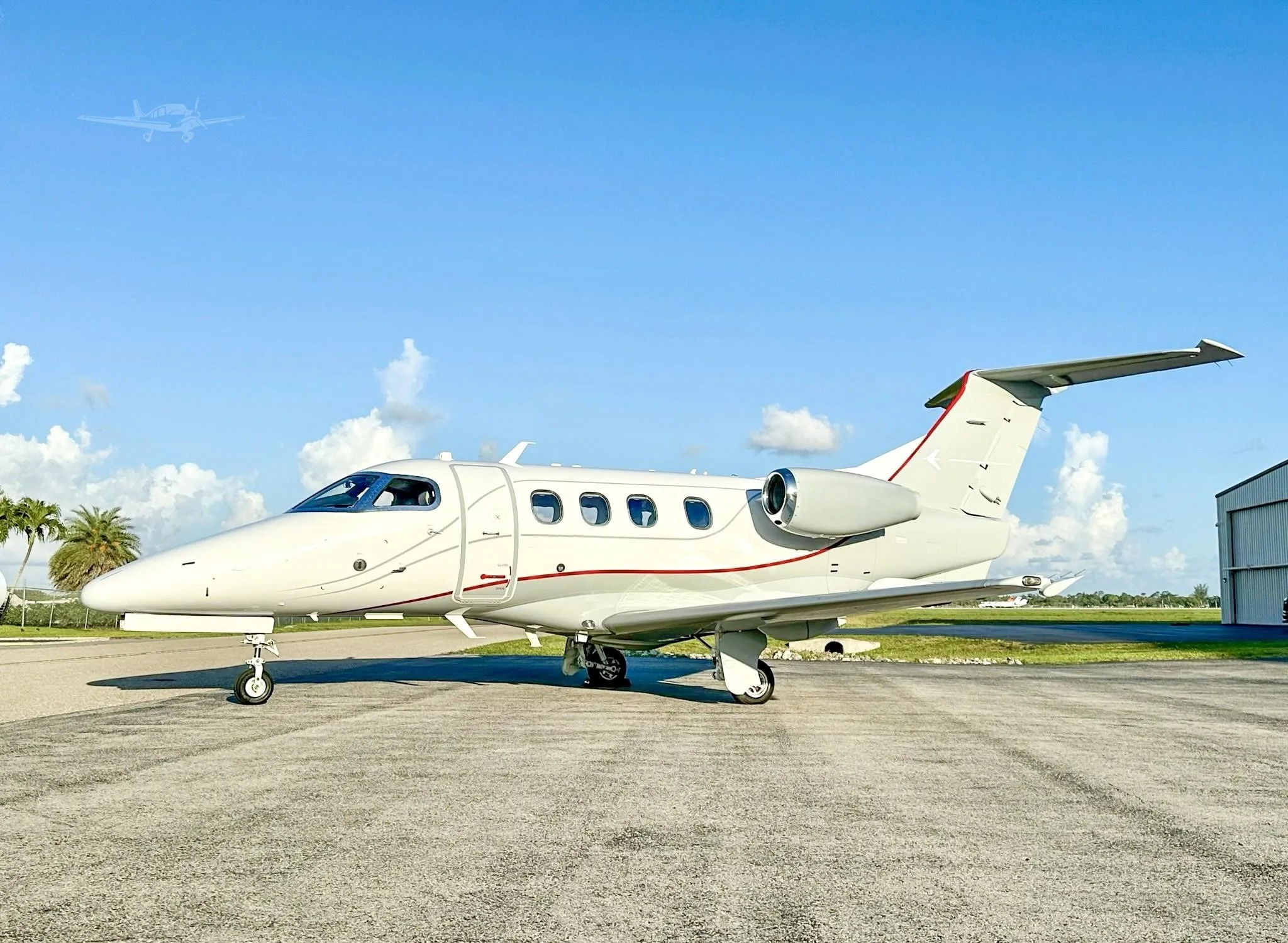 Exterior view of a 2009 EMBRAER PHENOM 100, N701TW.