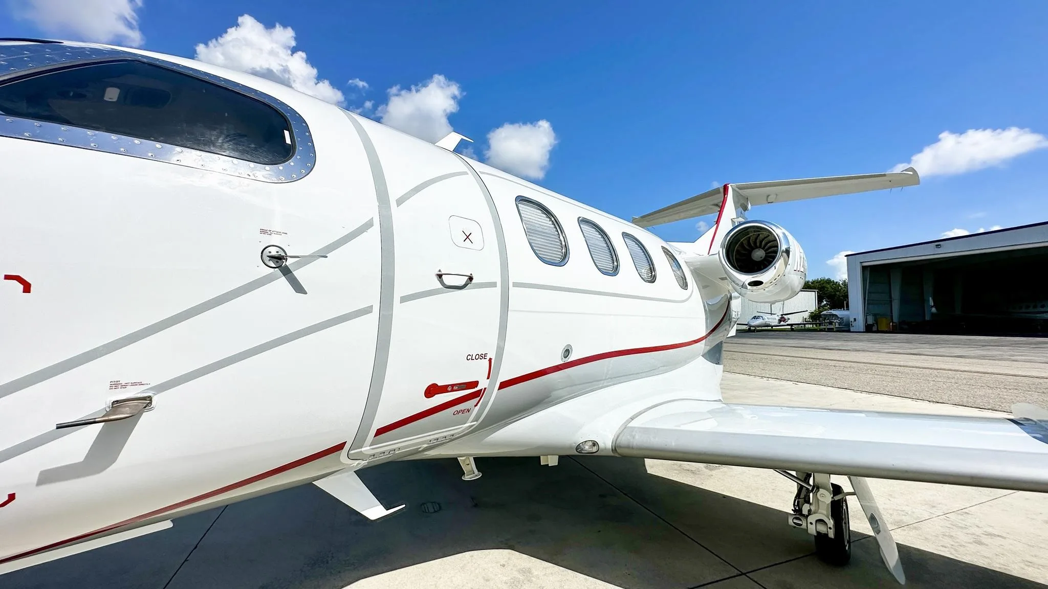 Exterior view of a 2009 EMBRAER PHENOM 100, N701TW.