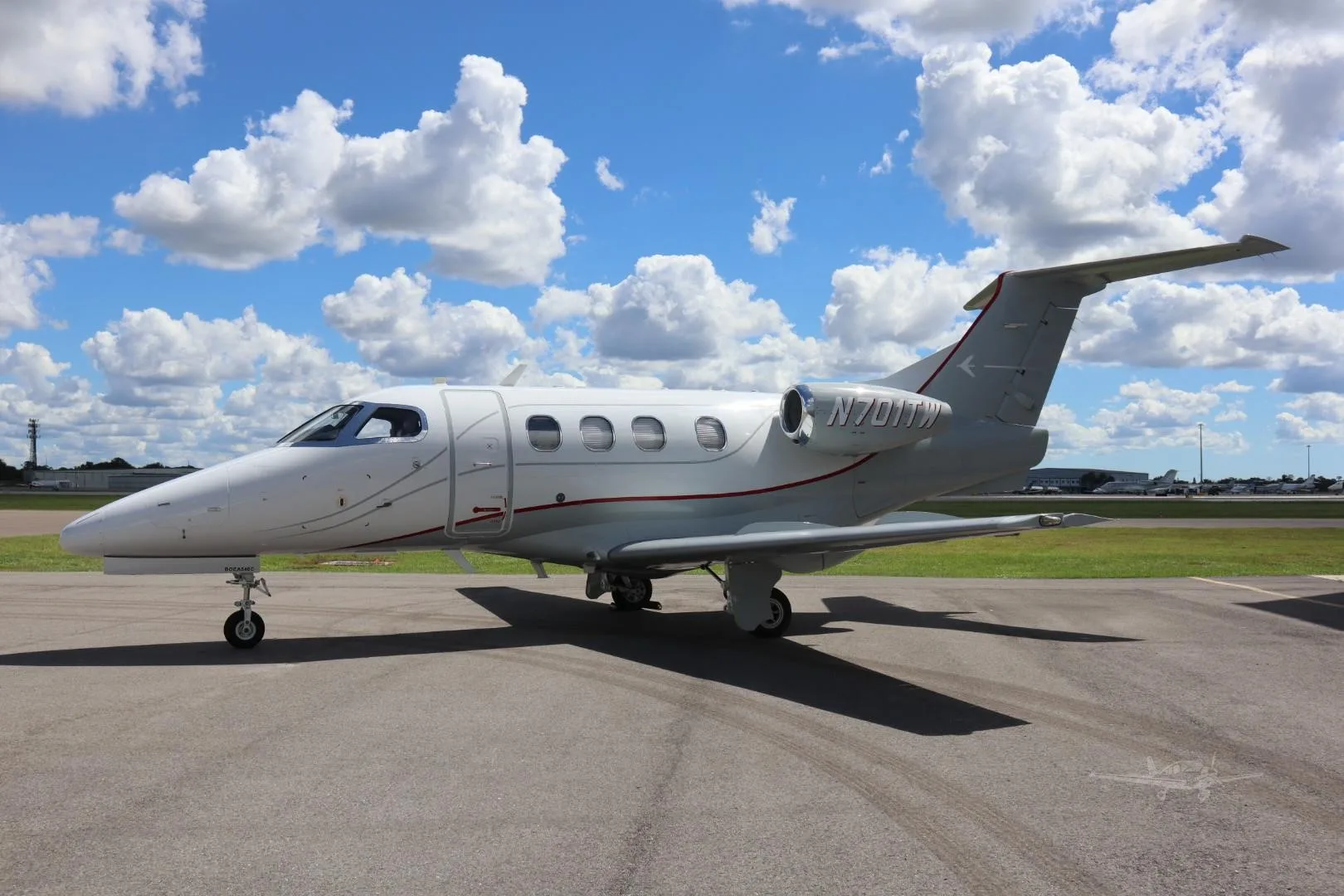 Exterior view of a 2009 EMBRAER PHENOM 100, N701TW.